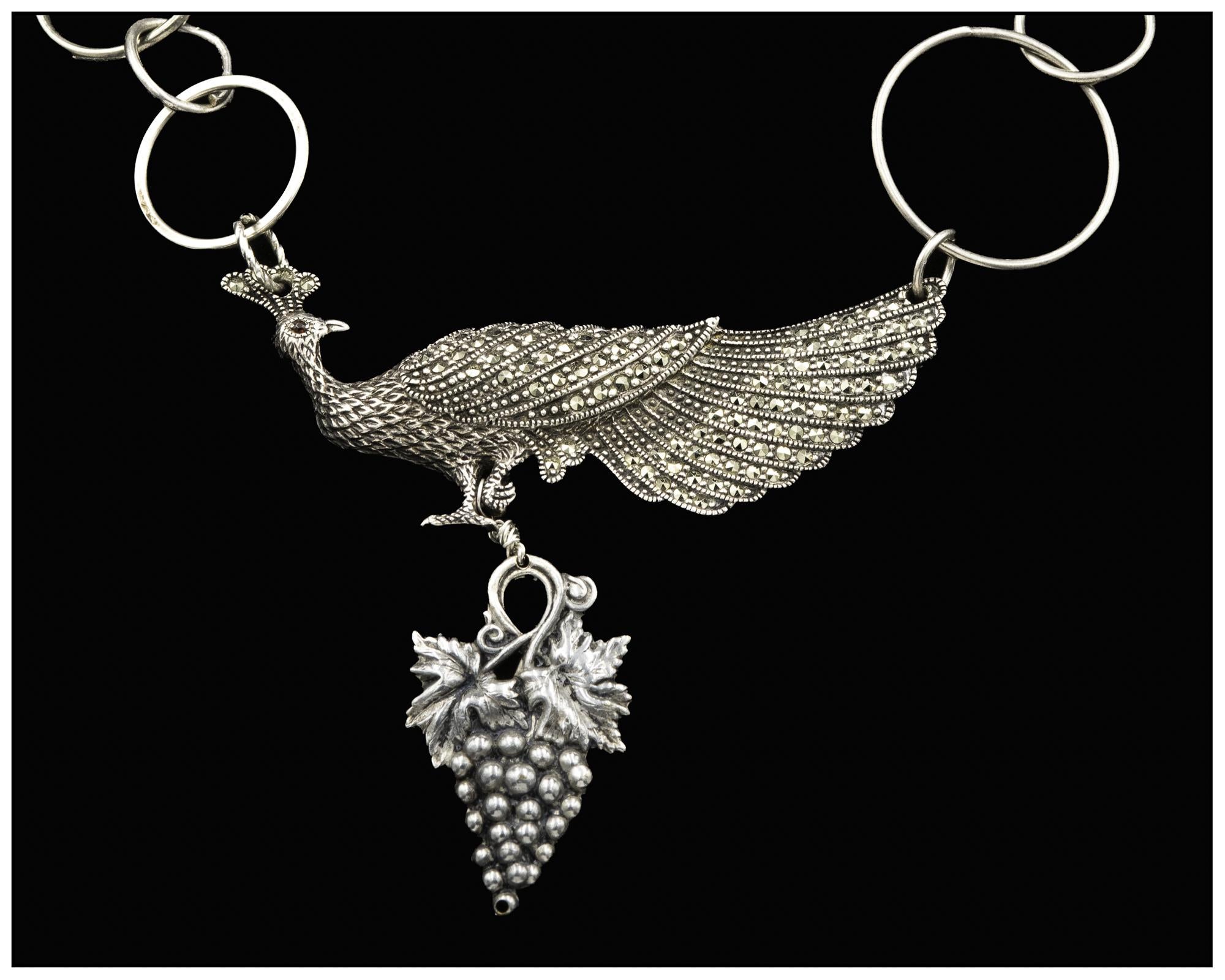 Sterling silver and marcasite vintage peacock brooch pendant with sterling silver rings and beads is on offer from Lorraine’s Bijoux.This mid century handmade brooch has lovely sinuous lines and is totally encrusted with hand set marcasite.The
