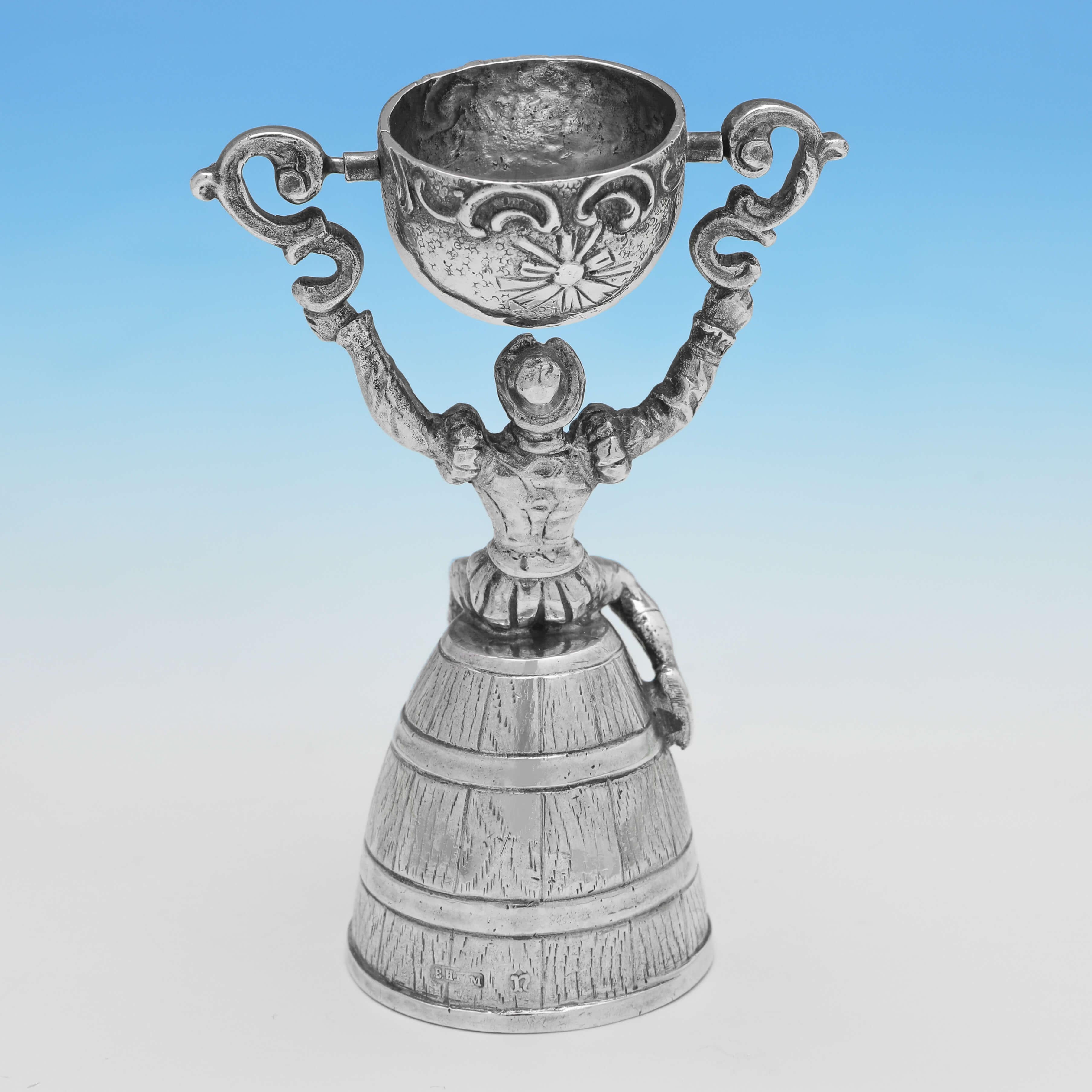 Carrying import marks for London in 1912 by Berthold Muller, this handsome, Antique Sterling Silver Wager Cup, is modelled as a Gentleman siting on a beer barrel. The wager cup measures 3