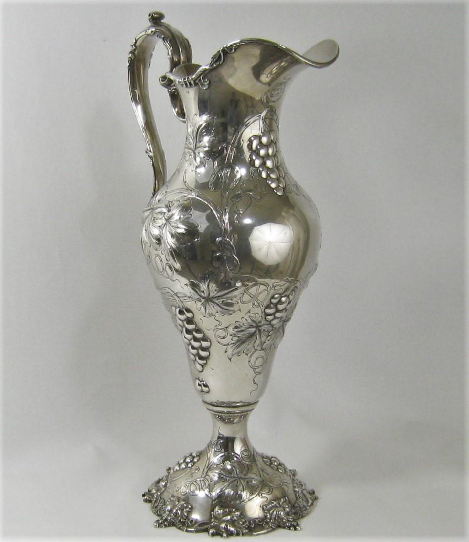 Impressive sterling silver water or wine pitcher made circa 1880 made by Black, Starr & Frost, New York, New York. Nicely hand chased grape and vine motif. Marked at the bottom as shown, Black, Starr & Frost, 1840B, sterling silver. Approximately 17