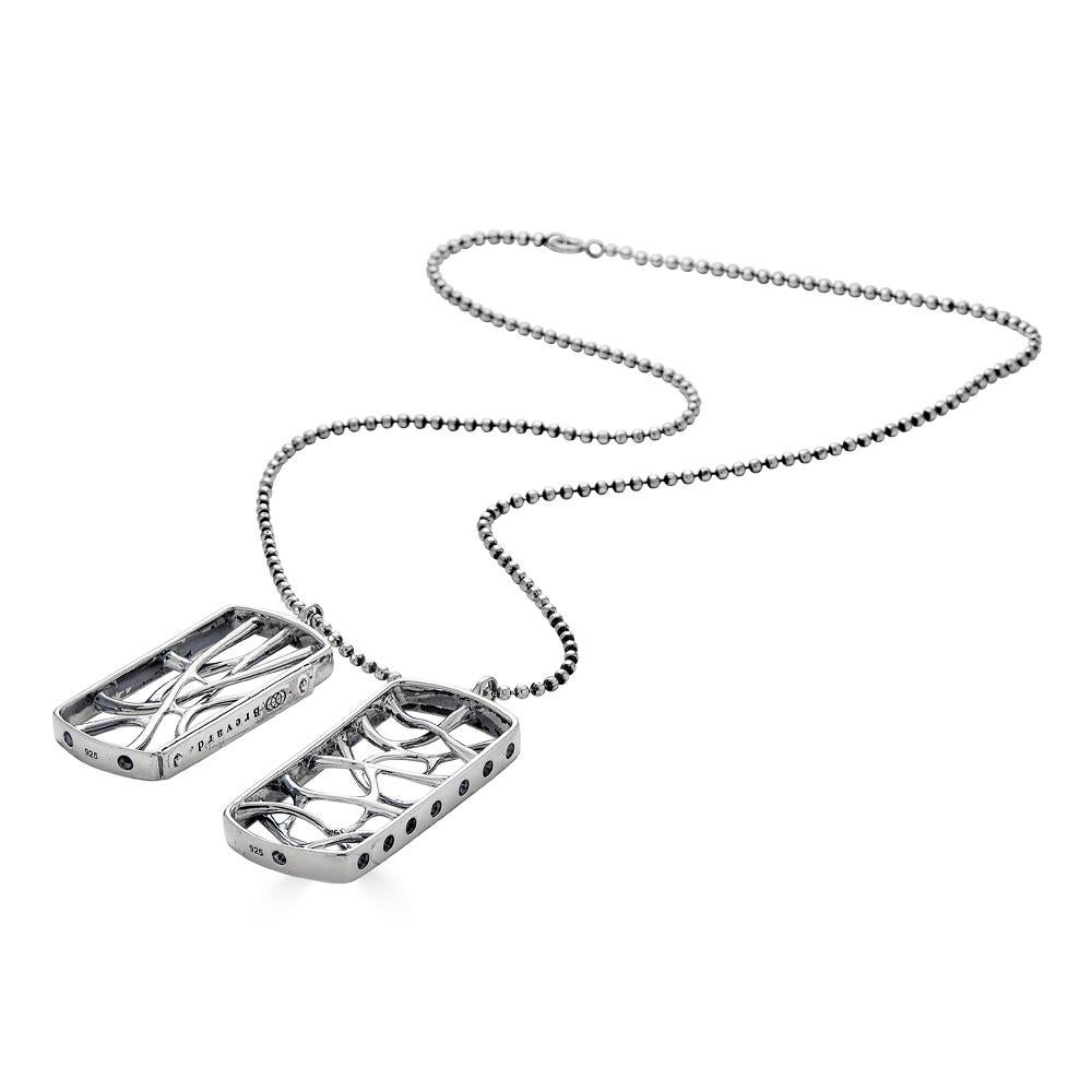 This Sterling Silver Web Dog Tag Necklace is inspired by the fractal and natural root systems. This intricately crafted, limited edition necklace features morphogenic patterns and is part of designer John Brevard’s Morphogen collection. The