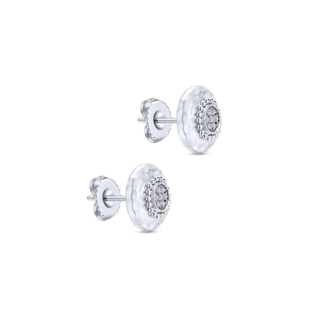 Sterling Silver, White Sapphires and Hammered Finish Stud Earrings. Earrings contain 0.12 ctw of genuine round white sapphires. Friction backs. Rhodium finish for tarnish free maintenance.