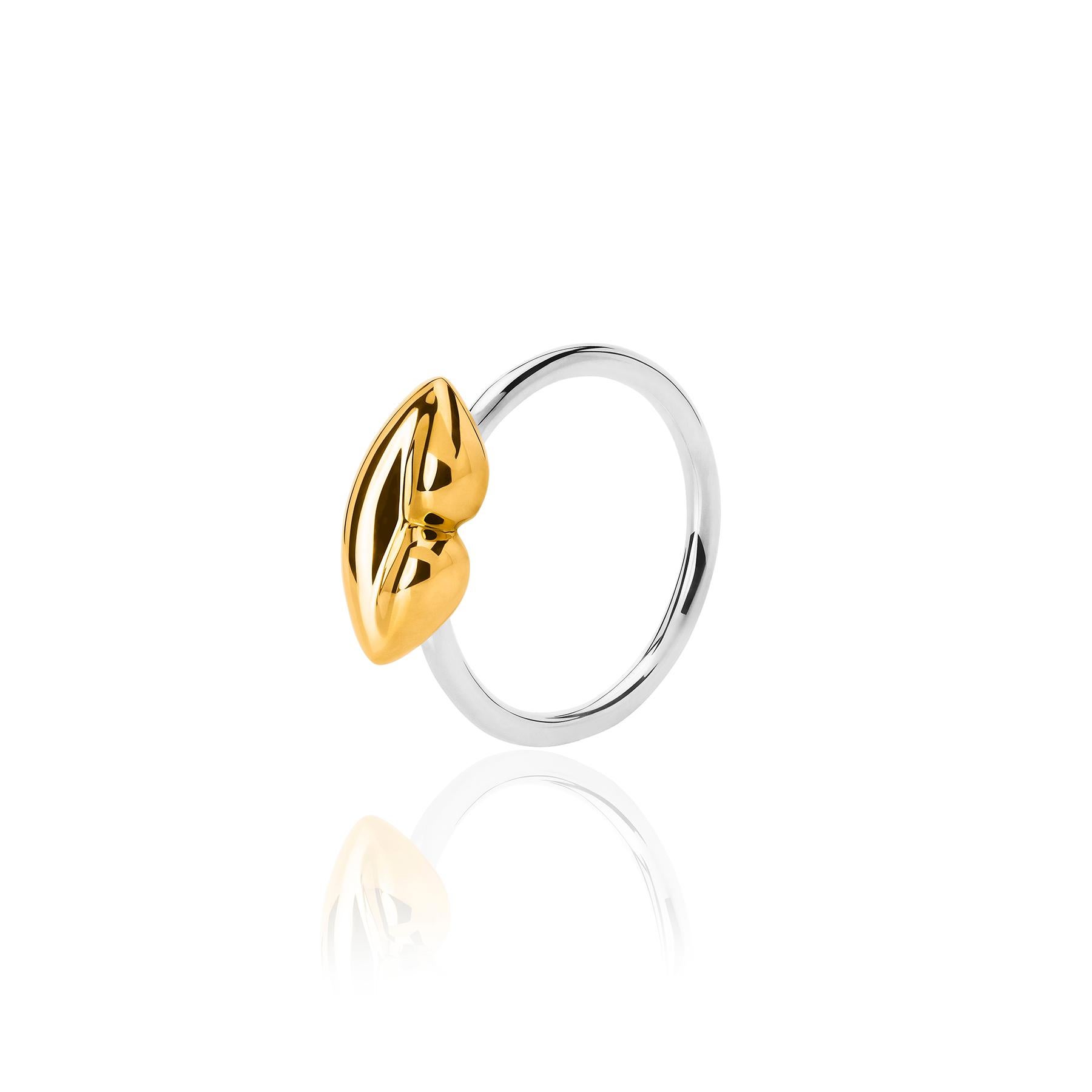 The Bésame Solitaire Vermeil Ring from the Bésame collection by TANE is made in sterling silver with 23 karat yellow gold vermeil. An elegant plain hoop is topped by a kiss finished in vermeil, gently sculpted in TANE's vision, the way to give a