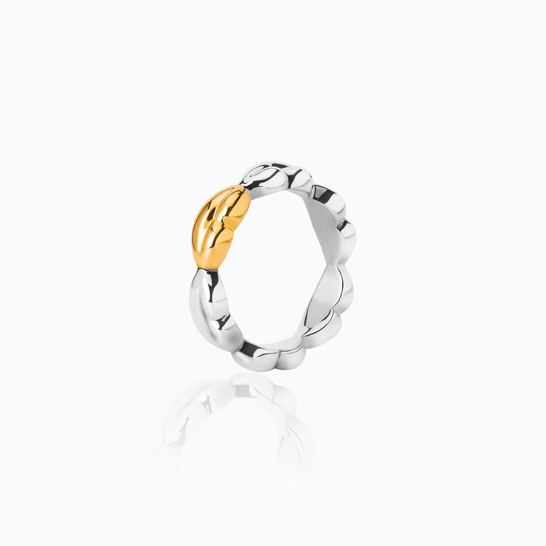 The Bésame Texture Vermeil Ring from the Bésame collection by TANE is made in sterling silver with 23 karat yellow gold vermeil. The piece is made up of a succession of small kisses gently sculpted in TANE's vision fused on the edges. The repetition