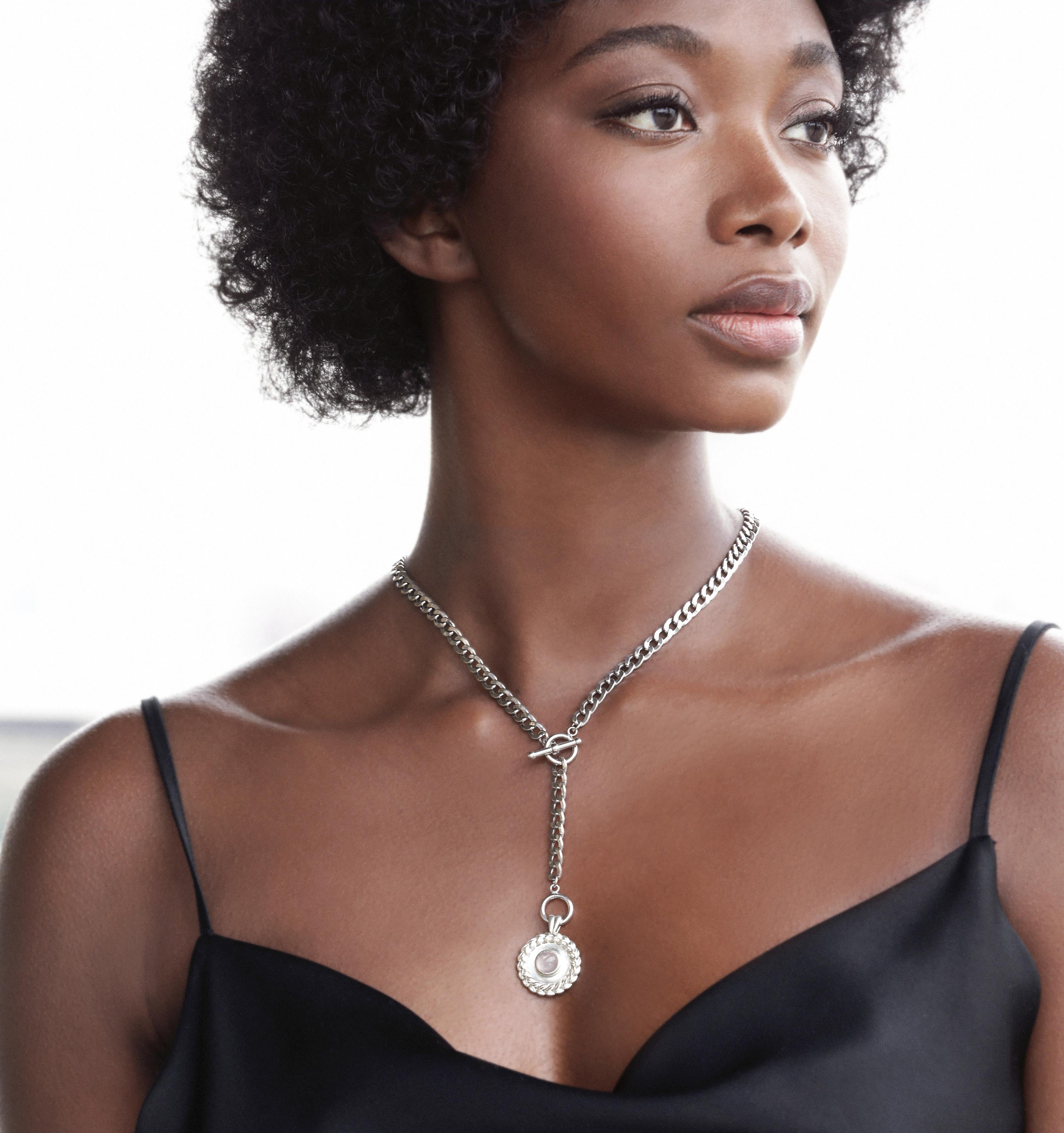 The classic curb chain is terrific alone, but this stunner adds the extra punch with a solid coin pendant and adjustable lariat style.

Available in Sterling Silver or 18Karat Yellow Gold Vermeil Curb Chain
Semiprecious stones in Pink Rose Quartz or