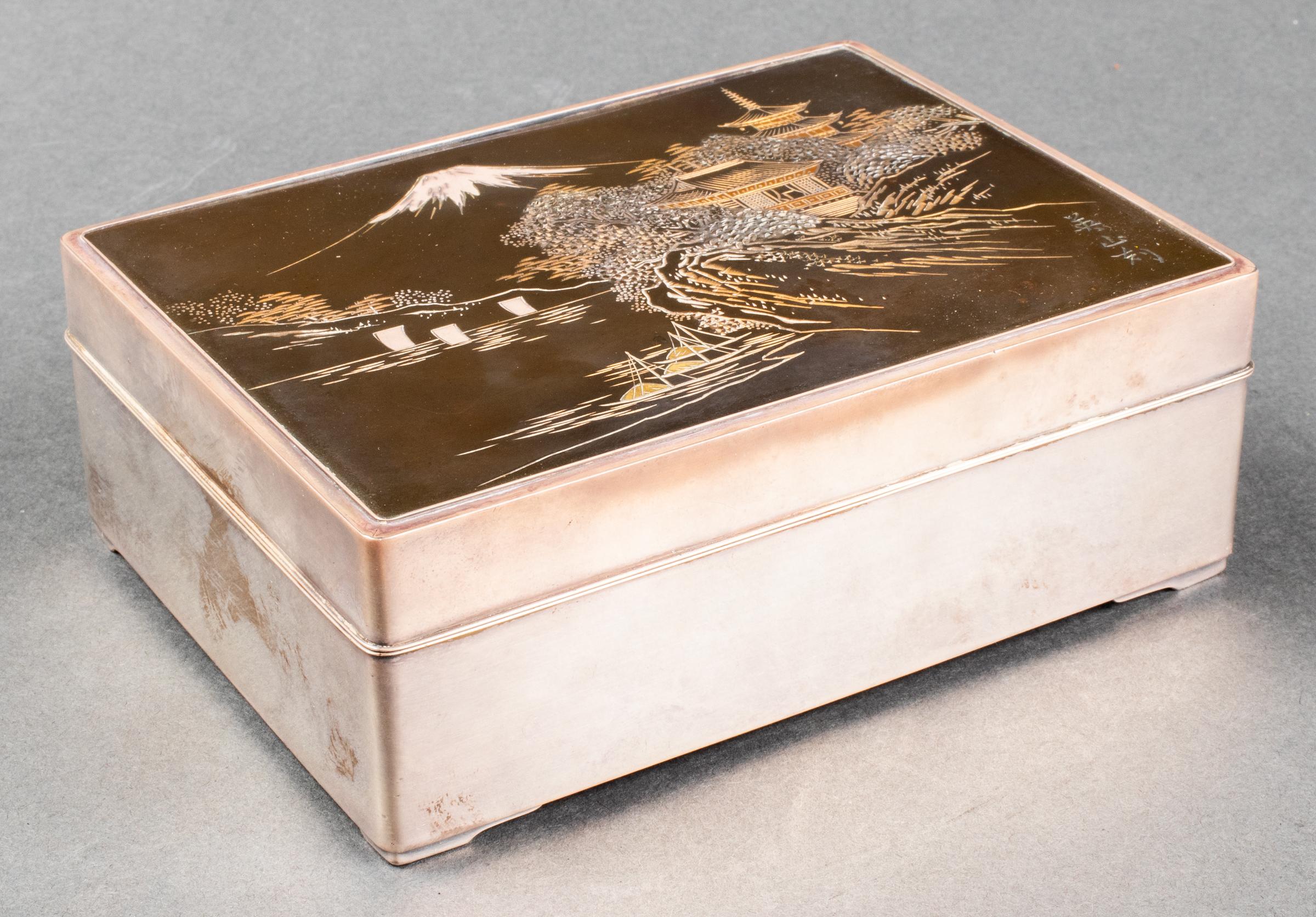 Dresser box with mixed metal lid depicting Japanese scene of Mount Fuji, hardwood interior and sterling silver exterior, marked: 