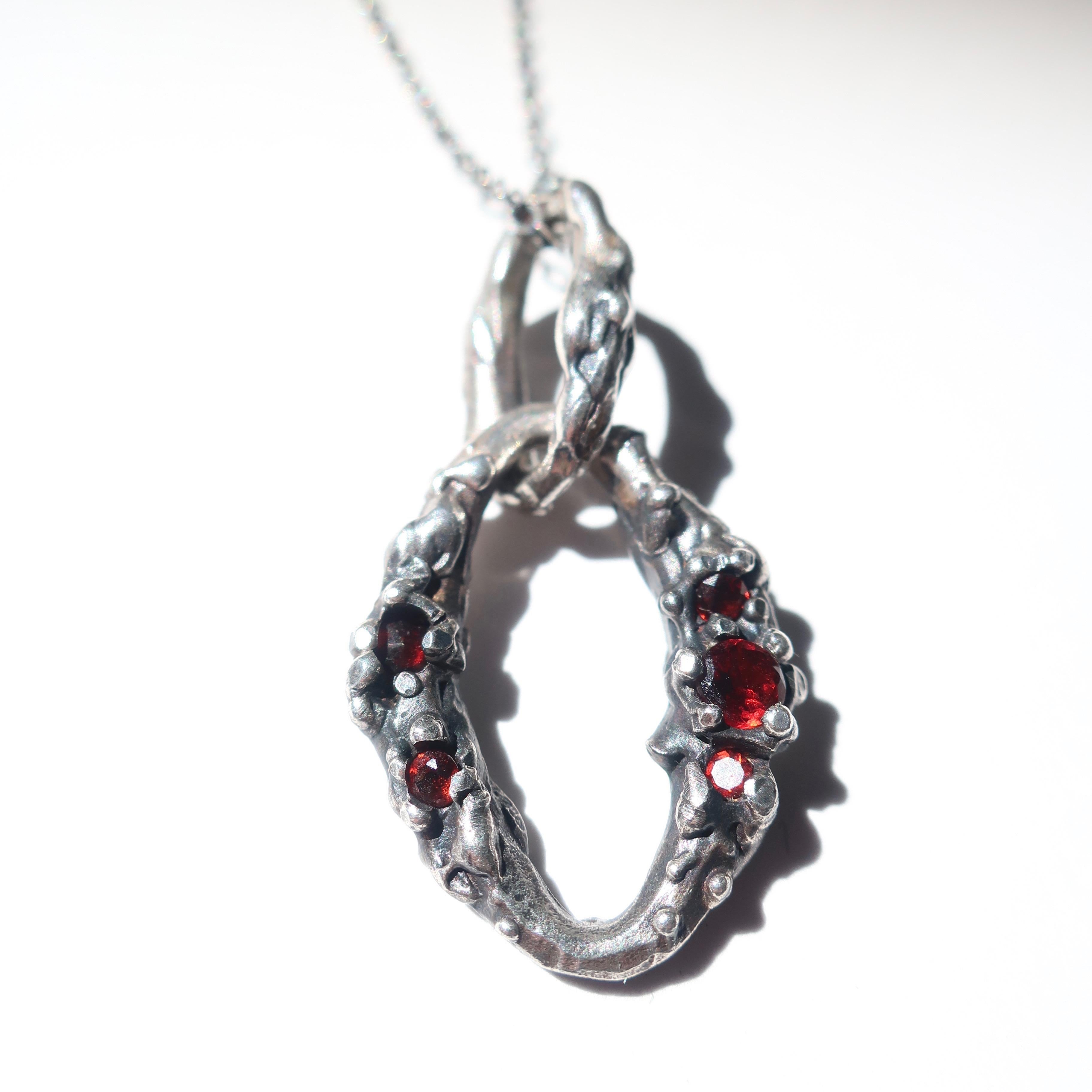 Artist Sterling Silver Worn Garnet Encrusted Link Pendant For Sale