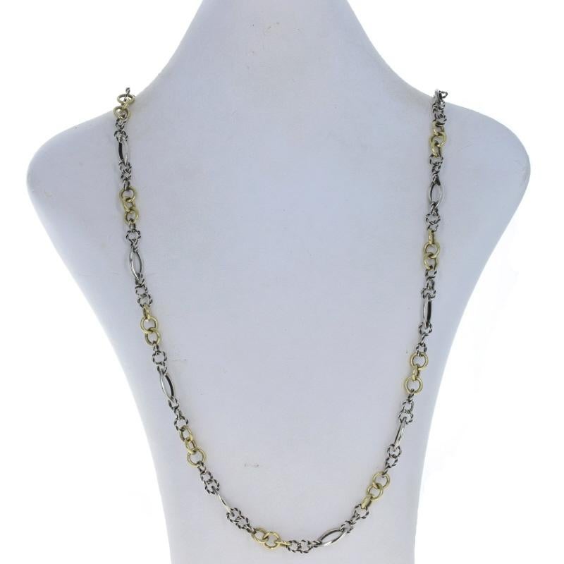 Metal Content: 925 Sterling Silver & 18k Yellow Gold

Chain Style: Fancy
Necklace Style: Chain
Fastening Type: Lobster Claw Clasp
Features:  Smooth & rope links

Measurements
Length: 39