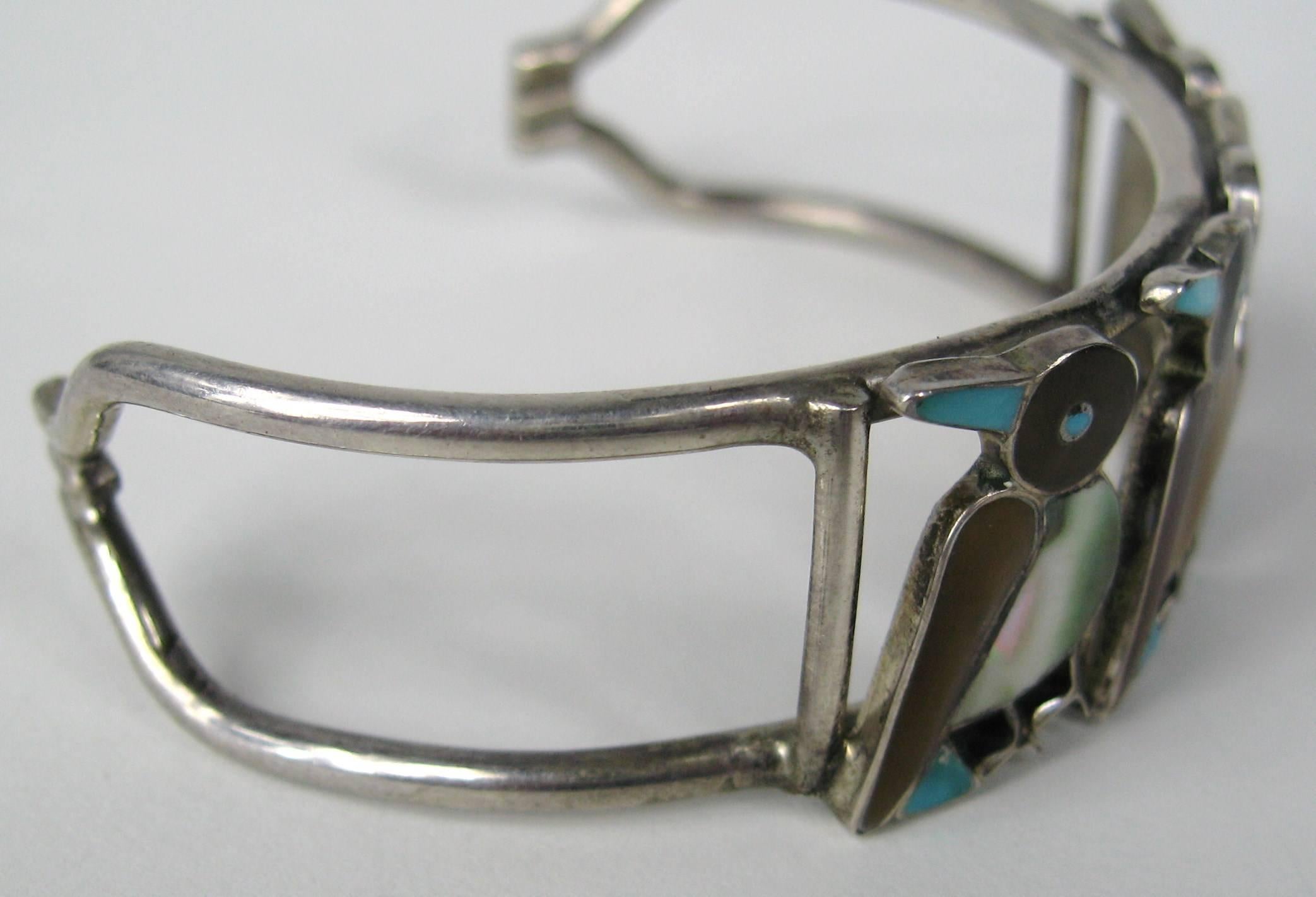 Four Zuni Birds Sterling Bracelet with Inlaid Stones Will fit a 6.5 to 7-inch wrist comfortably this is a little give to the bracelet. Measuring 3/4  wide 1.25 opening. This is out of a massive collection of Costume Jewelry, Hopi, Zuni, Navajo,