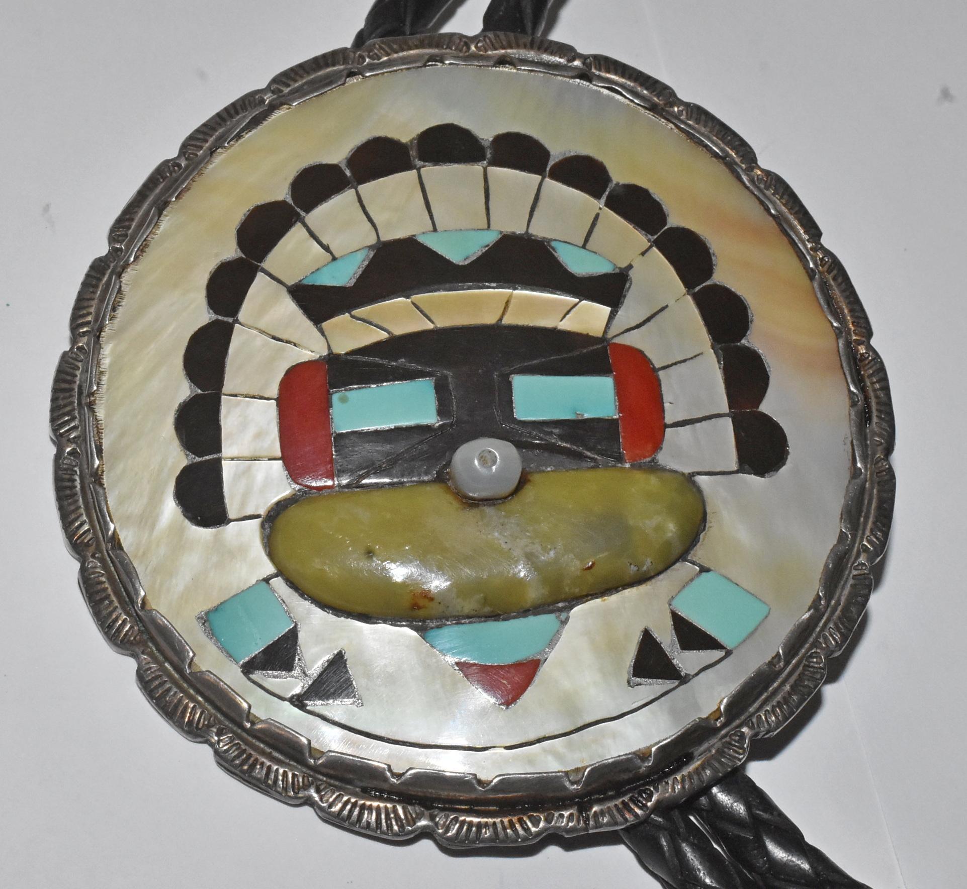 Sterling silver Zuni bolo by Elliot Qualo. Circa 1960's. Elliot Qualo born on the Zuni Reservation in the 1930s was a very prolific silver artist in the 60's until his death in the late 70's. An exceptional silver inlaid bolo of Mother of Pearl,
