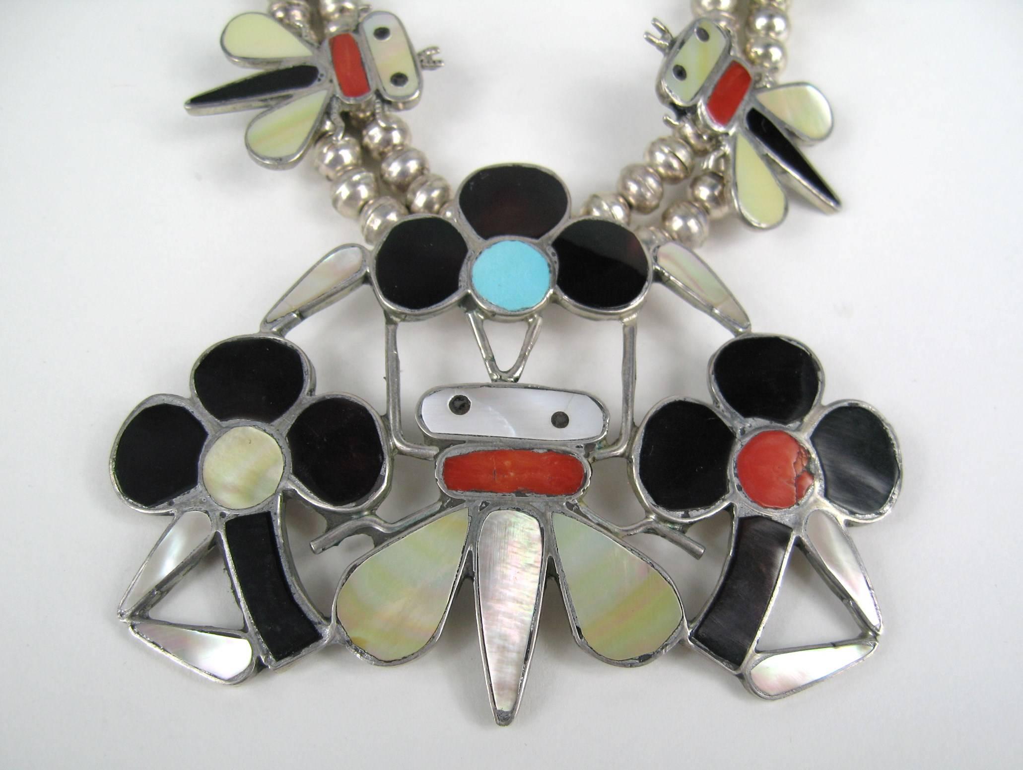 TANNER CHANEY - Zuni artist Sensa Eustace created this circa 1970's sterling silver and channel inlay honey bee squash blossom necklace set.  Zuni artist Sensa Eustace created this circa 1970's sterling silver and channel inlay honey bee squash