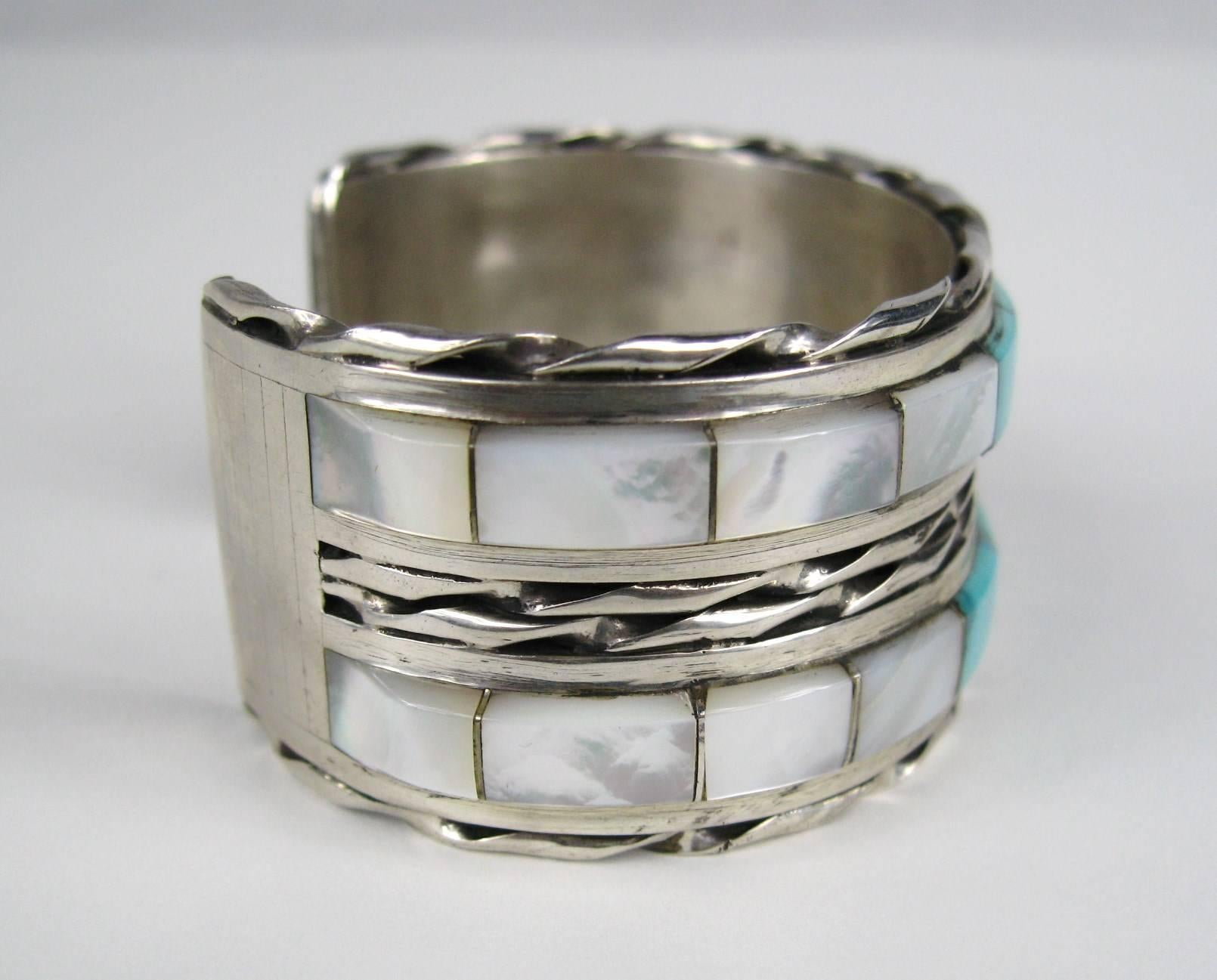 Double Row Inlaid Turquoise and Mother of pearl Bracelet. Measuring Hallmarked MTPANTEAH...1.15 in wide ...1.15 in opening on the back 
will fit 6.5 to 7 in wrist nicely. This piece is clean, clear, bright, precise, extraordinarily well-made, and