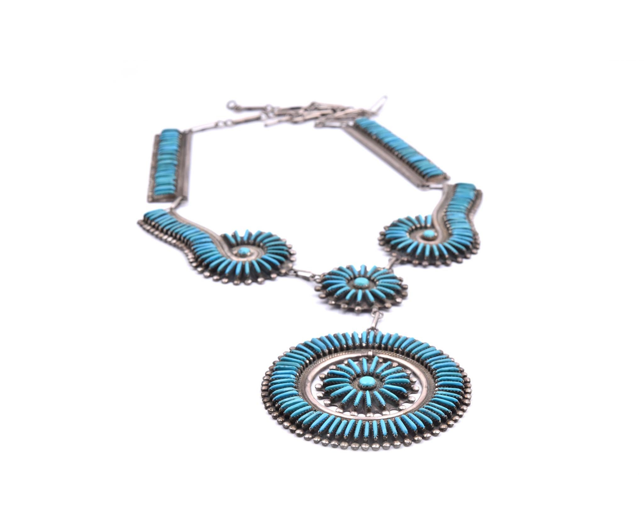 Designer: custom design
Material: sterling silver
Gemstones: turquoise
Dimensions: necklace is 18 ½ -inches long with medallion measuring 76.12mm in diameter 
Weight: 134.57 grams
