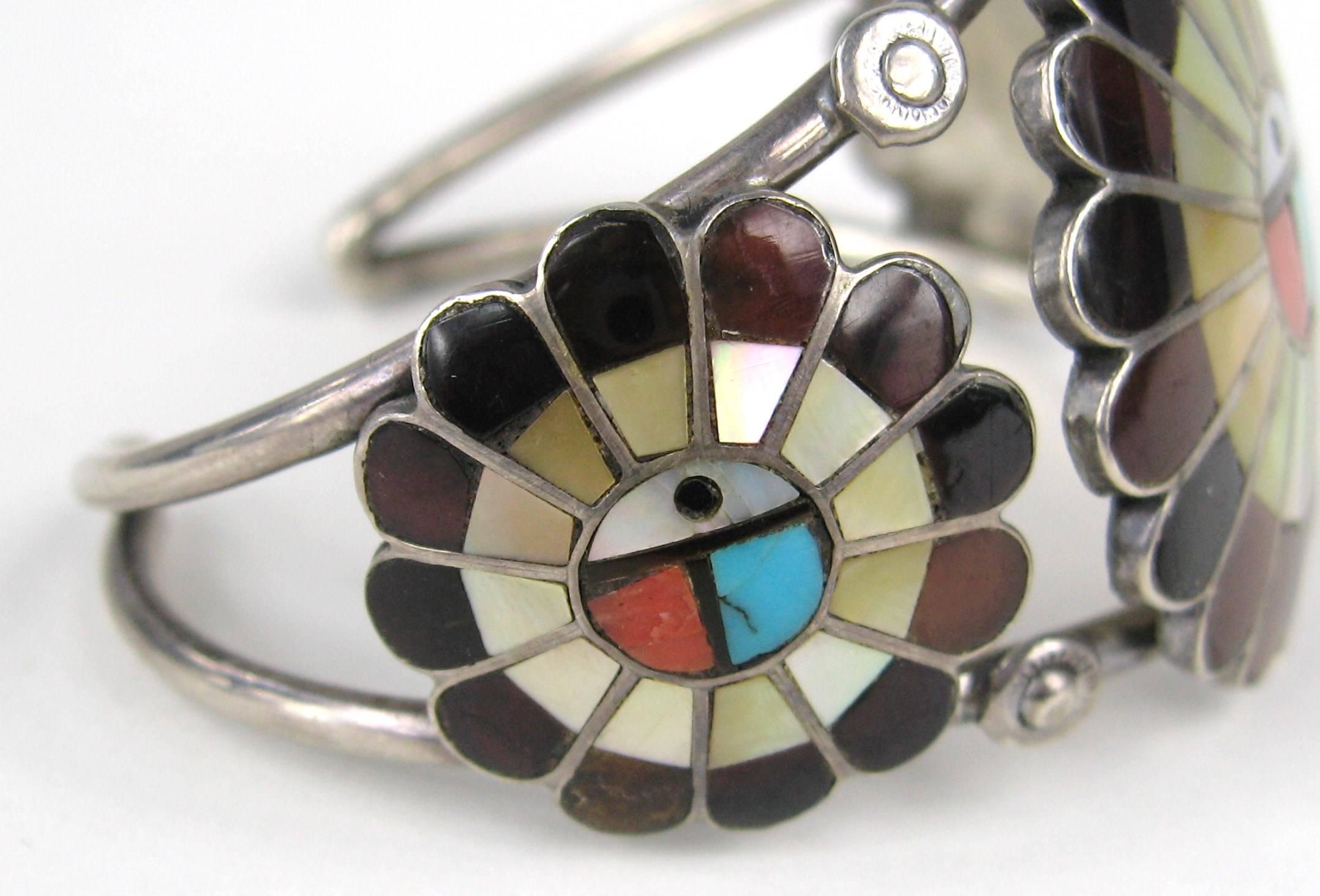 Zuni sun face bracelet. Sleeping Beauty Turquoise, Coral, Jet, Abalone, and Penn Shell. 2 Ring Band. Measuring 1.50 in top to bottom. opening is .95 in on the cuff. Will fit a 6 to 7 in wrist. Is a bit pliable to fit. This is out of a massive