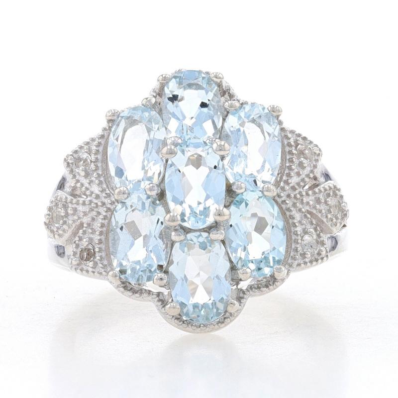 Size: 7
Sizing Fee: Down 1 size or up 2 sizes for $30

Metal Content: 925 Sterling Silver

Stone Information

Natural Sky Blue Topaz 
Treatment: Routinely Enhanced 
Carat(s): 4.00ctw
Cut: Oval

Natural White Topaz 
Carat(s): .12ctw
Cut: Round

Total