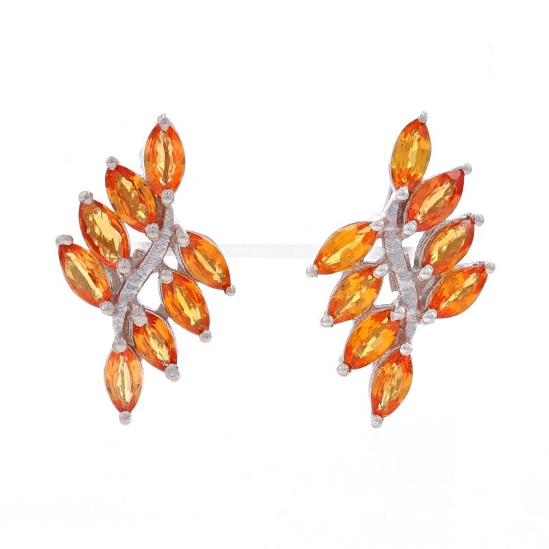 Metal Content: Sterling Silver

Stone Information

Natural Spessartite Garnets
Carat(s): 1.30ctw
Cut: Marquise
Color: Orange

Total Carats: 1.30ctw

Style: Cluster Bypass Drop
Fastening Type: Butterfly Closures
Theme: Leaves

Measurements

Tall: