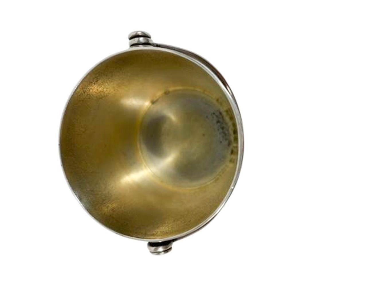 Nicely detailed early twentieth century sterling silver pail form spirit measure / jigger modeled with banded staves and with a swing handle. Marked 