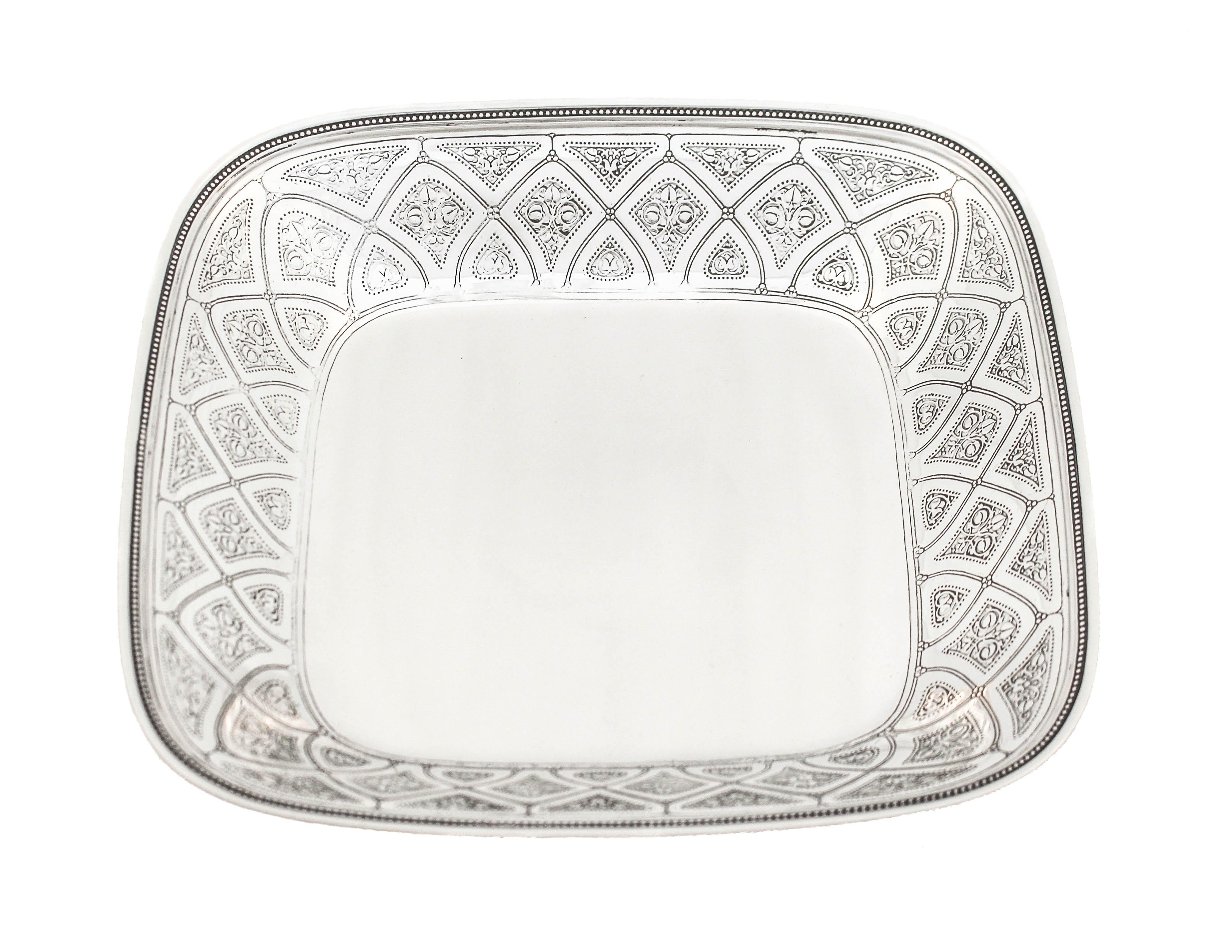 Proudly offering this unique Tiffany & Co. square dish. Practically identical to Tiffany’s Persian pattern, the piece has etching around the entire border. A reticulated pattern with diamond shaped etchings in between each one.
 