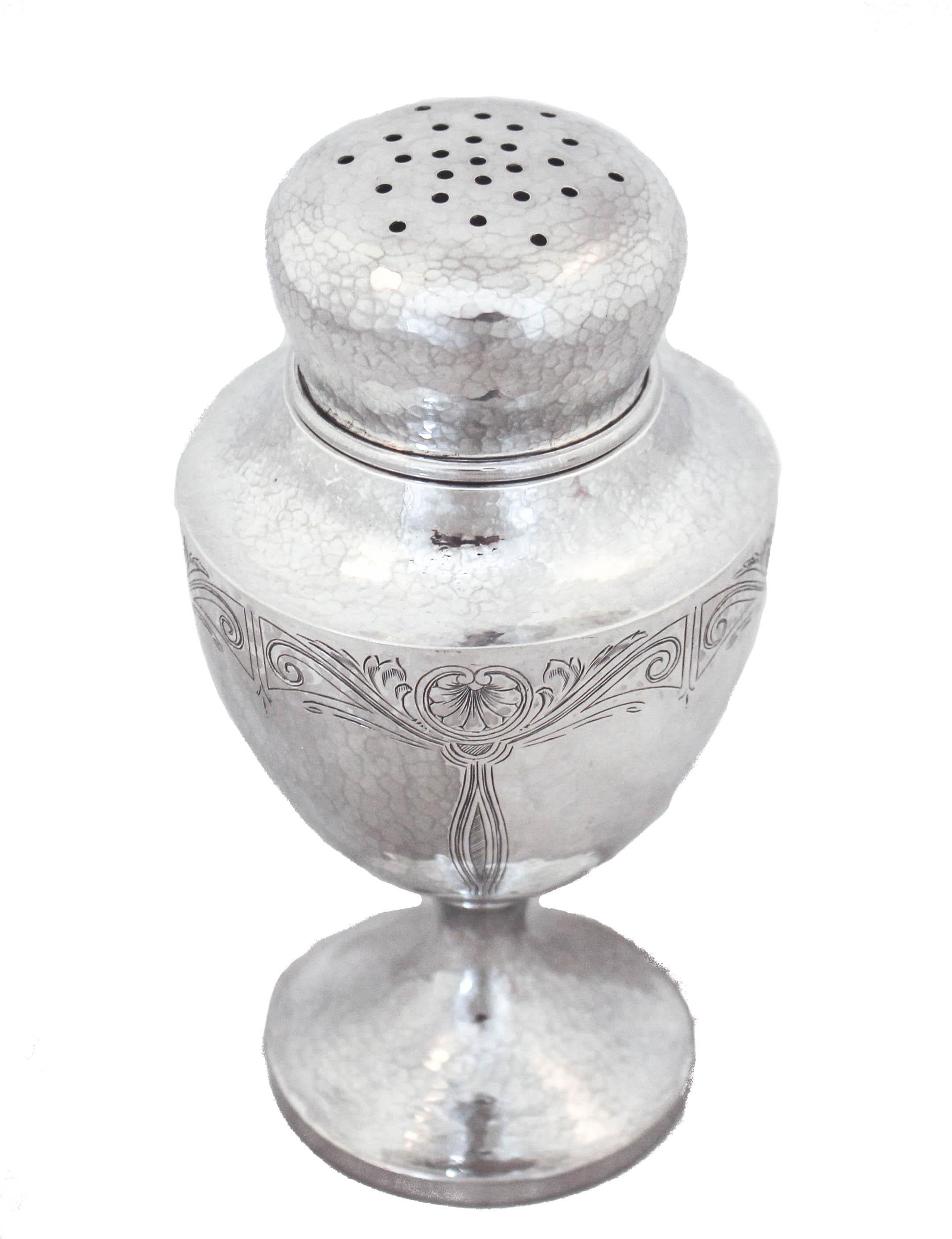 This sterling silver sugar caster is hand hammered and has an etched design around the body. This style is called Arts and Crafts. The core characteristics of the Arts and Crafts movement are a belief in craftsmanship which stresses the inherent