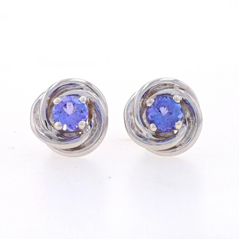 Metal Content: Sterling Silver

Stone Information
Natural Tanzanites
Treatment: Routinely Enhanced
Carat(s): .80ctw
Cut: Round
Color: Purple

Total Carats: .80ctw

Style: Stud
Fastening Type: Butterfly Closures
Theme: Rope Twist