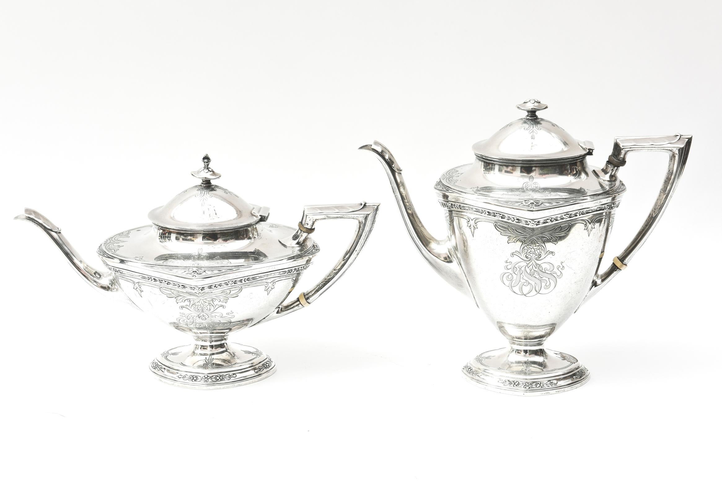 A fine vintage sterling silver coffee and tea service by Wallace. This classic set includes coffee pot, tea pot, creamer, sugar bowl with lid and side or waste bowl. Nice size and detailed metal work. Nicely proportioned pedestal bases and handles.