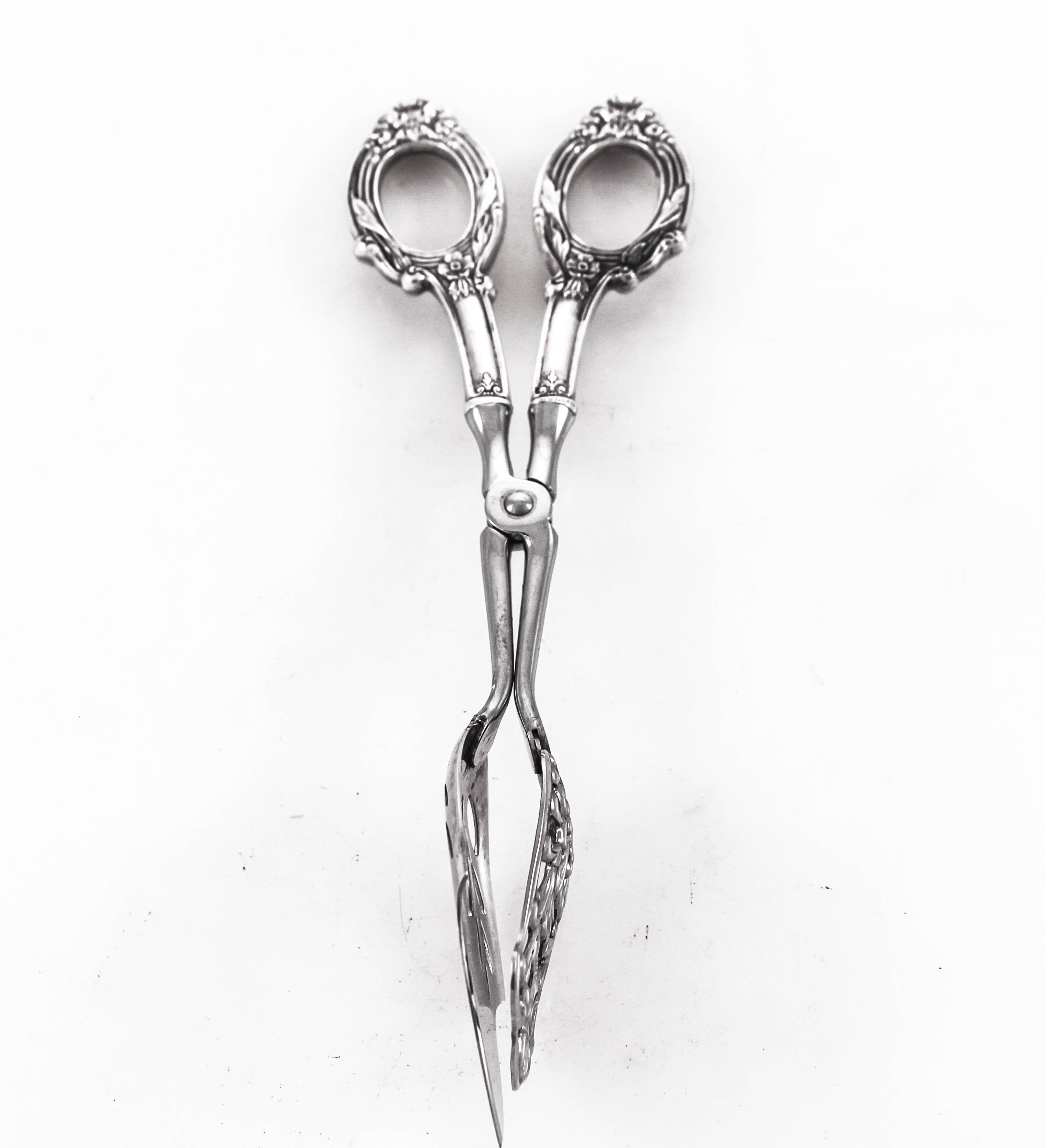 A sterling silver serving tong that is perfect for hors d’oeuvres and/or desserts. When a serving spoon or fork aren’t right for serving a pair of tongs is what you need. Shaped like a pair of scissors, these tongs have a flat surface that’s ideal