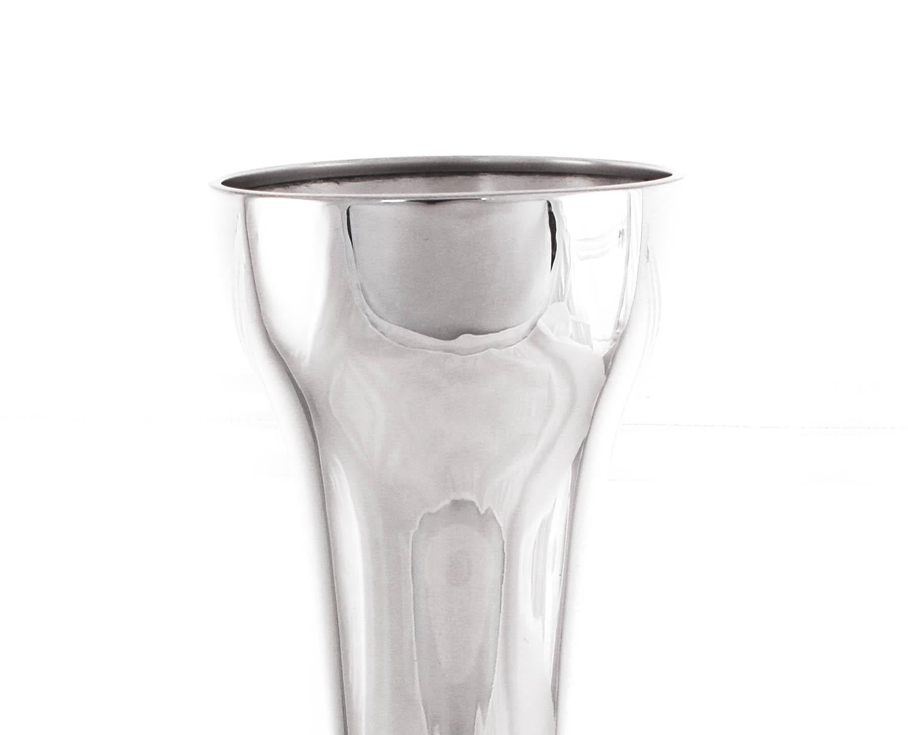 A modern, sleek vase by the Watson Company of Massachusetts. The shape is interesting; it has a column-like feel to it. It’s the perfect size for a handful floral arrangement not too big and not too small.
 