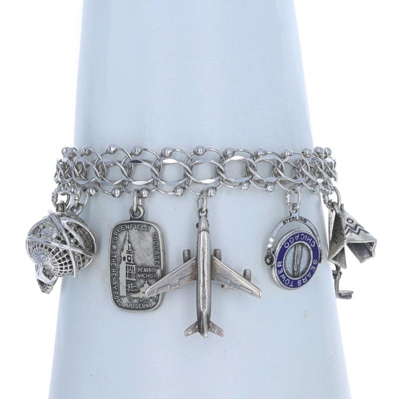 Era: Vintage

Metal Content: Sterling Silver

Material Information
Enamel
Color: Blue

Style: Charm
Fastening Type: Tab Box Clasp with One Side Safety Clasp & Safety Chain
Theme: United States Travel

Measurements

Item 1: Bracelet
Chain Width: