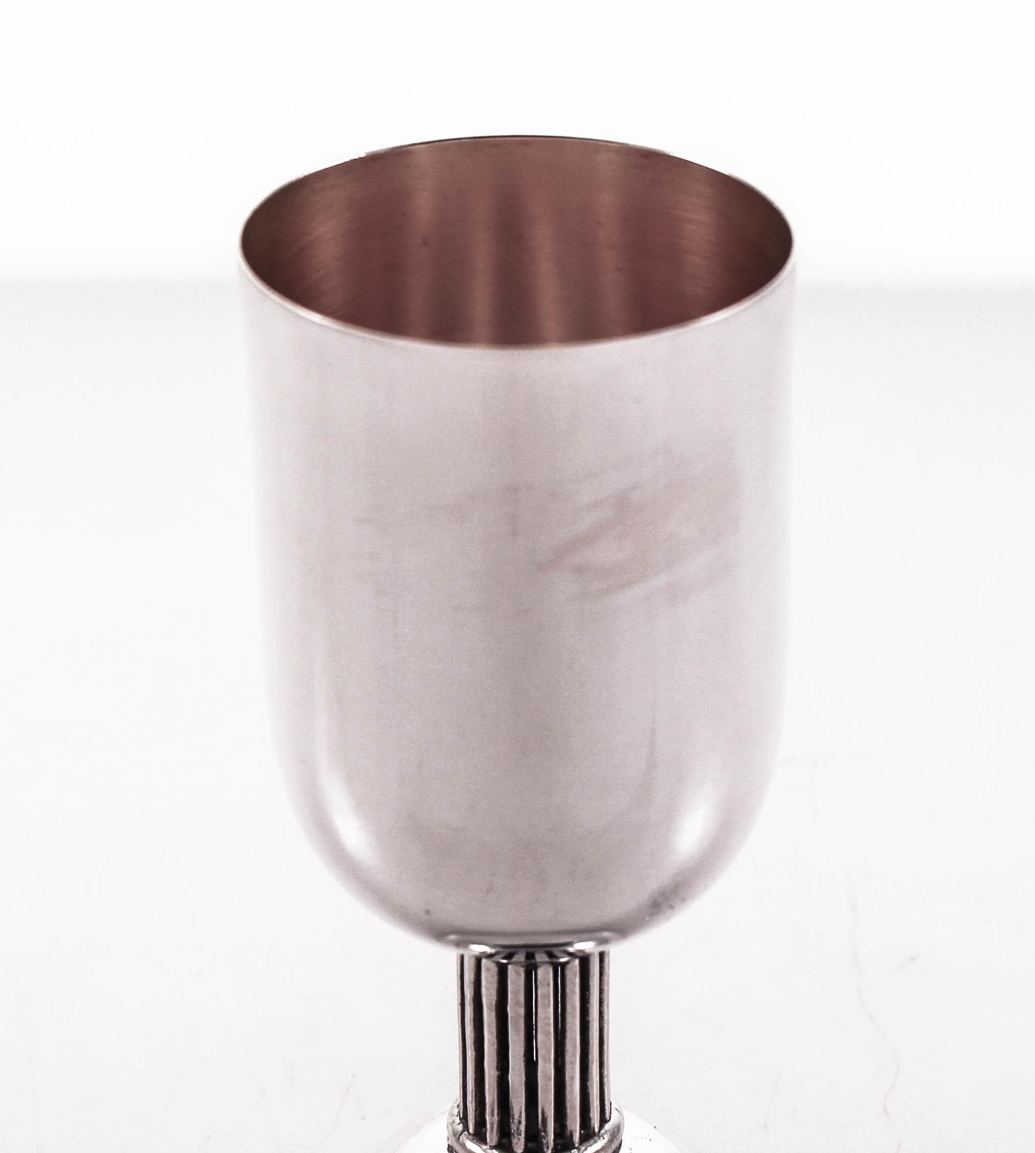 We are delighted to offer this sterling silver wine cup (Kiddush). It has a modern look and the stem is a colonnade. With straight lines and a light-feel, unlike the gaudy heavy designs you normally find in a goblet.