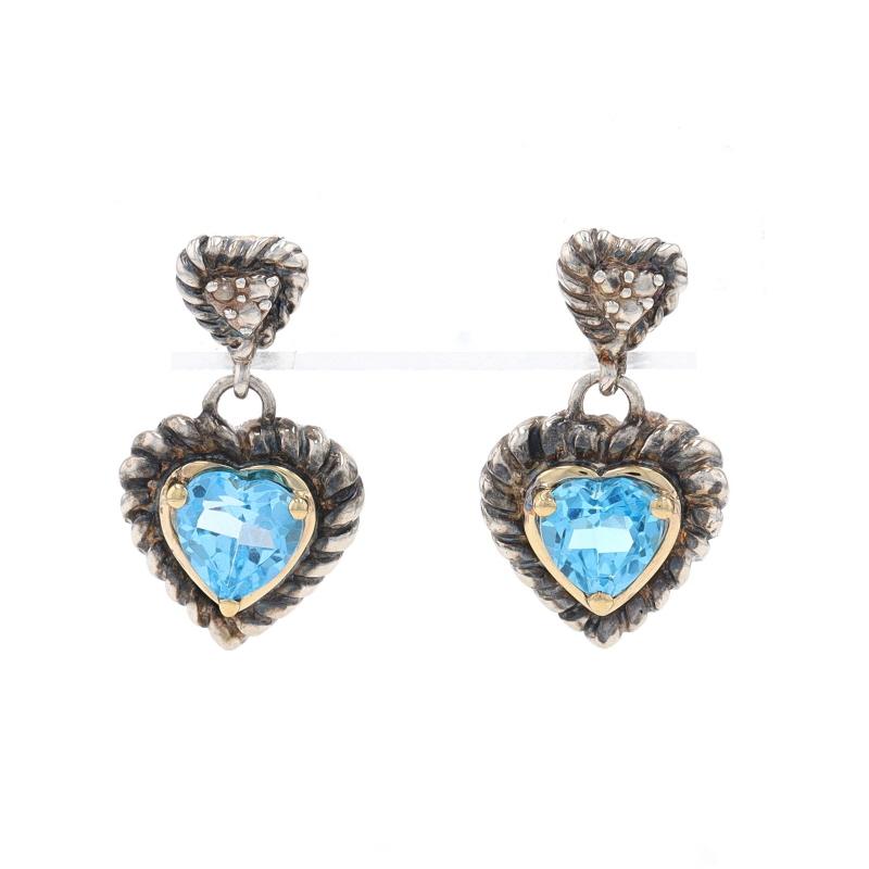 Metal Content: Sterling Silver & 14k Yellow Gold

Stone Information

Natural Blue Topaz
Treatment: Routinely Enhanced
Carat(s): .92ctw
Cut: Heart

Total Carats: .92ctw

Style: Dangle
Fastening Type: Butterfly Closures
Theme: Heart,