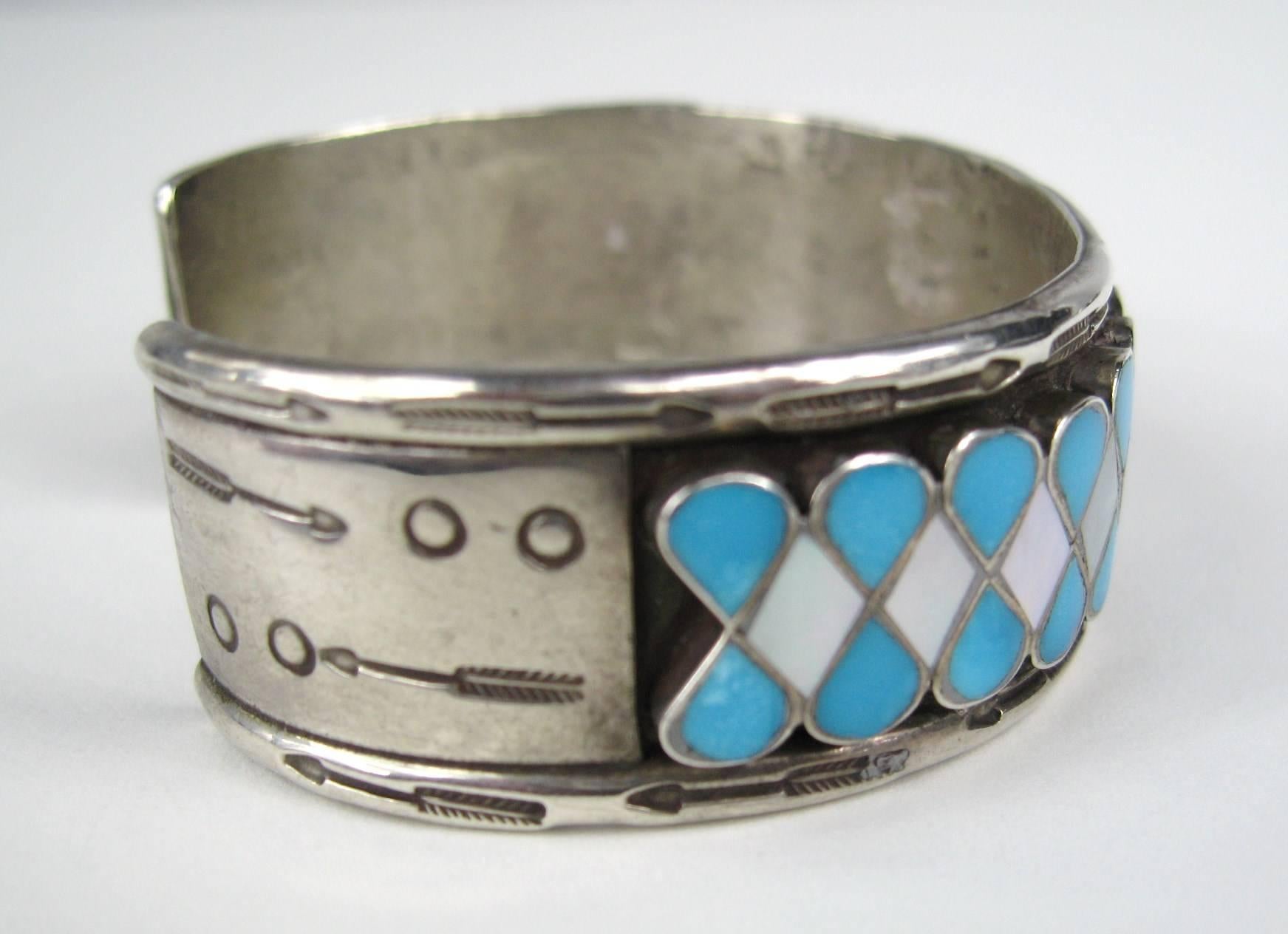 Zuni Arrow motif design on this Turquoise Cuff Bracelet. Hallmarked CL. Will fit a 6 to 7 in wrist nicely. It can be adjusted a bit smaller or larger. Measuring .81 in wide - 1.20 in the opening. This is out of a massive collection of New Old stock