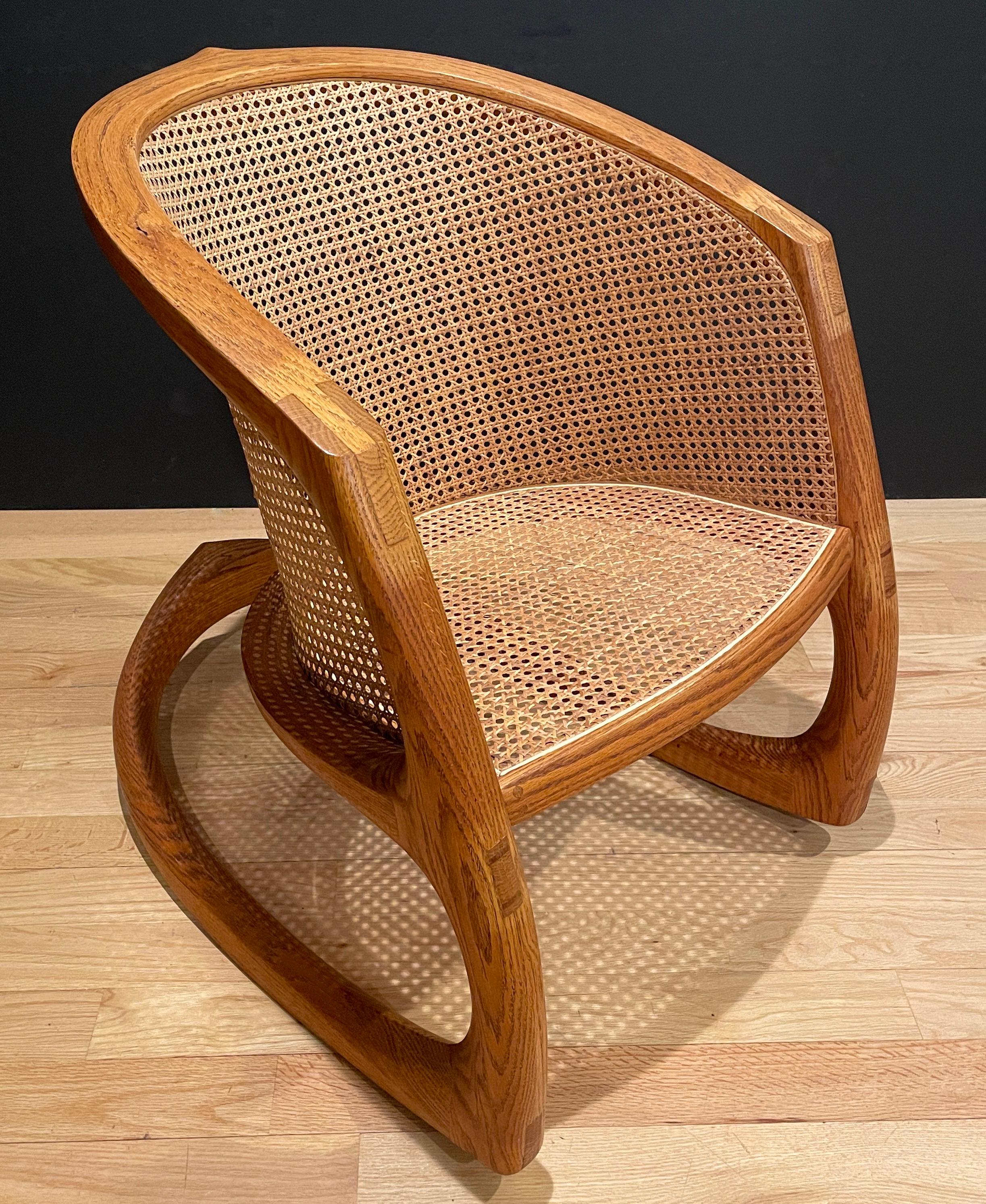 The “Sternum” rocker from David Ebner’s “Wishbone” series. Oak and cane. The entire form uses bent lamination technique.
“David Ebner played a pivotal role in the development of studio furniture during the twentieth and twenty-first centuries.