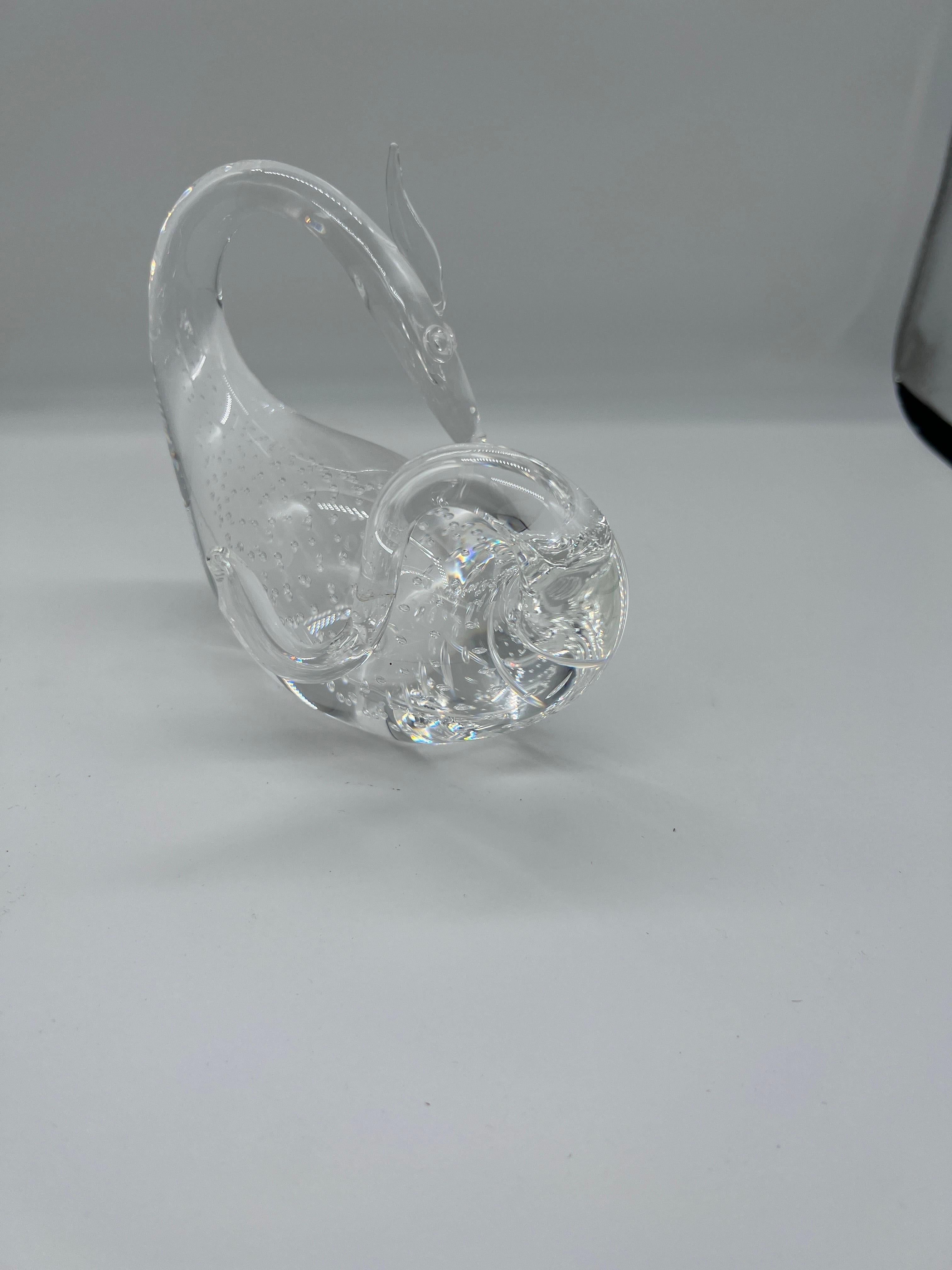 Steuben Controlled Bubble Crystal Dragon Figurine Designed by Bernard Wolff. 
This stunning crystal figure is made by the famous Steuben crystal company and has a completely handblown organic form with a controlled bubble interior. Signed to