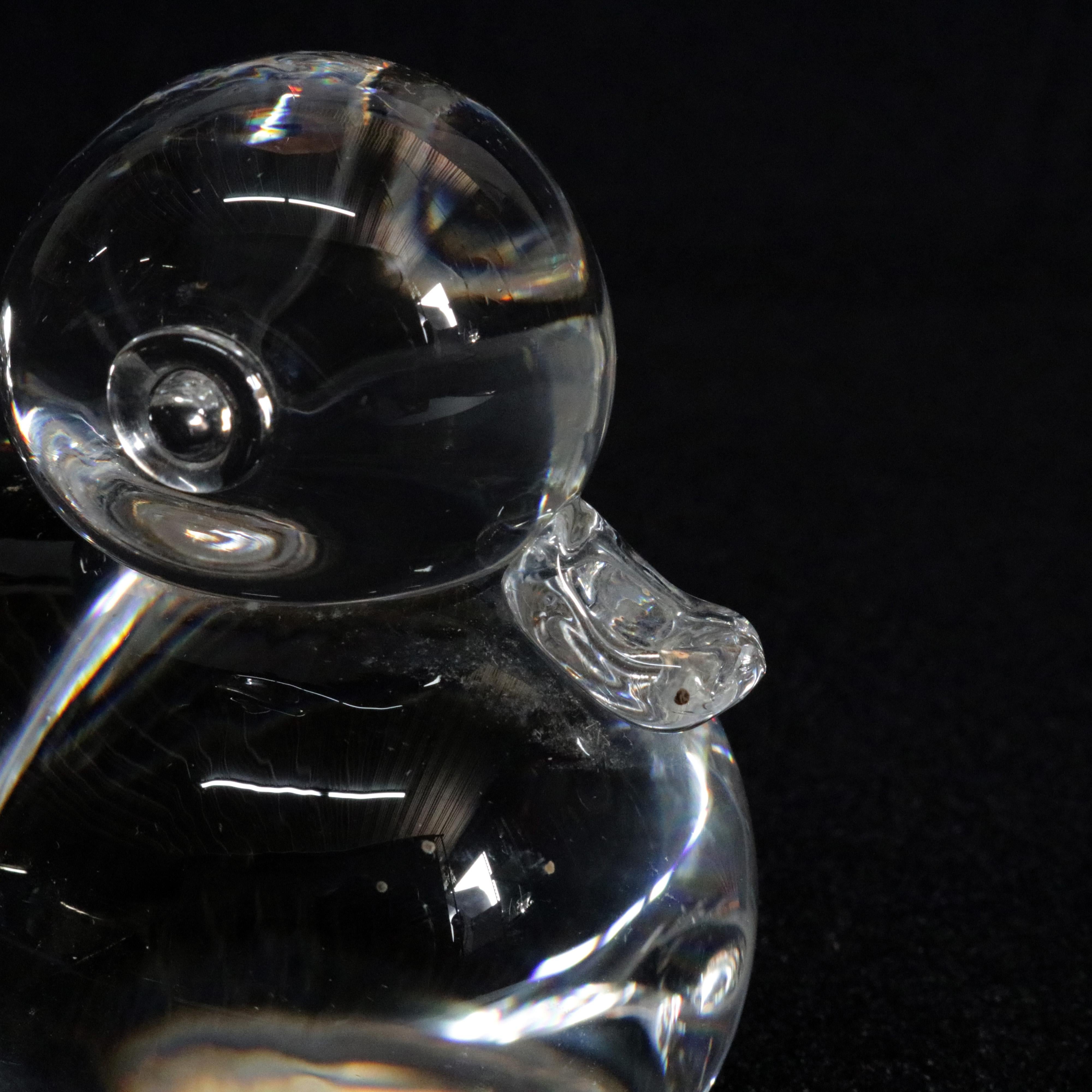 Midcentury Steuben figurative mouth blown crystal sculptural paperweight features colorless art glass in full body form of Baby Duck (duckling) designed by Lloyd Atkins 1950 for Corning Museum of Glass, New York, NY, signed on base, 20th