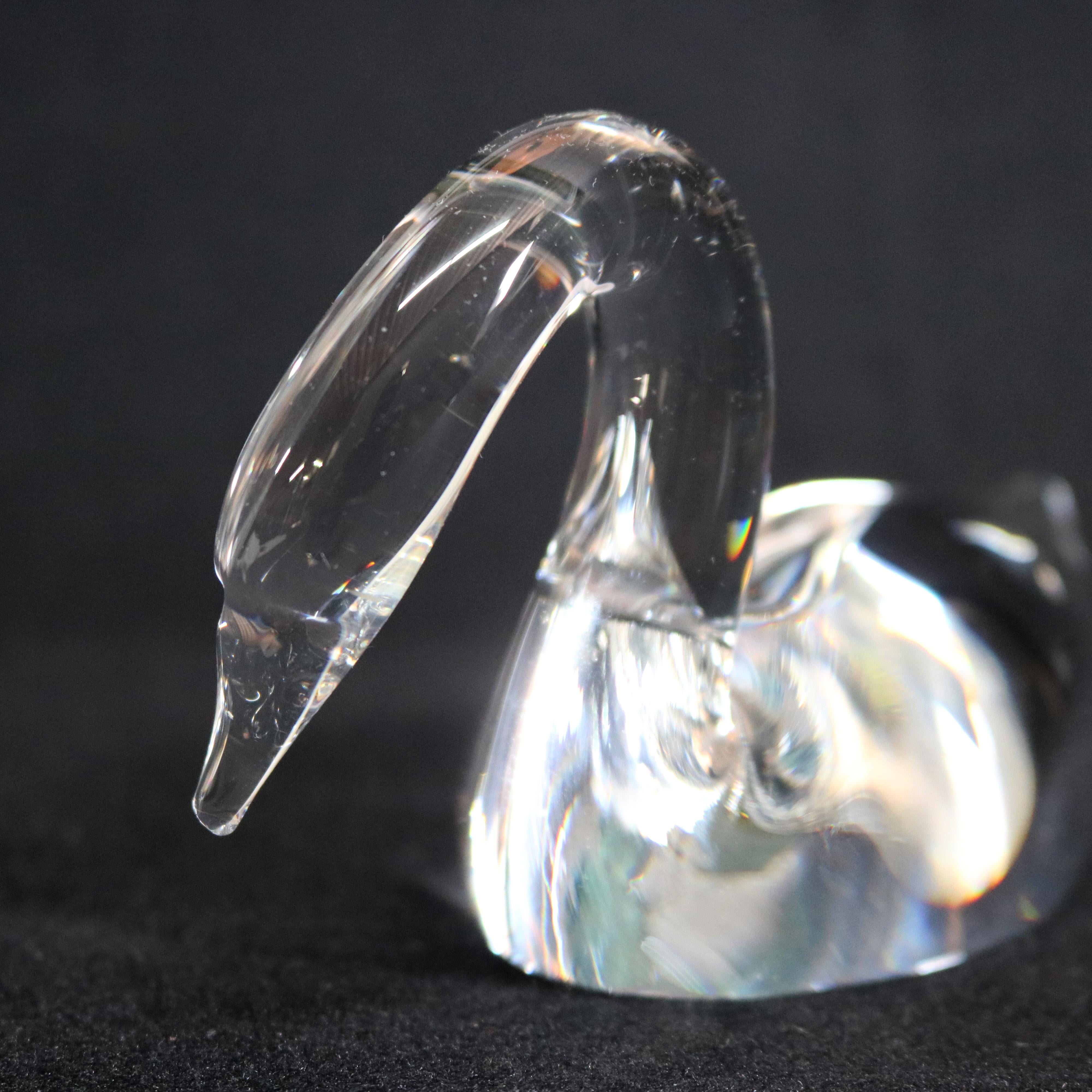 Midcentury Steuben figurative mouth blown crystal sculptural paperweight features colorless art glass in full body form of Straight Neck Swan designed by Lloyd Atkins 1984 for Corning Museum of Glass, New York, NY, signed on base, 20th