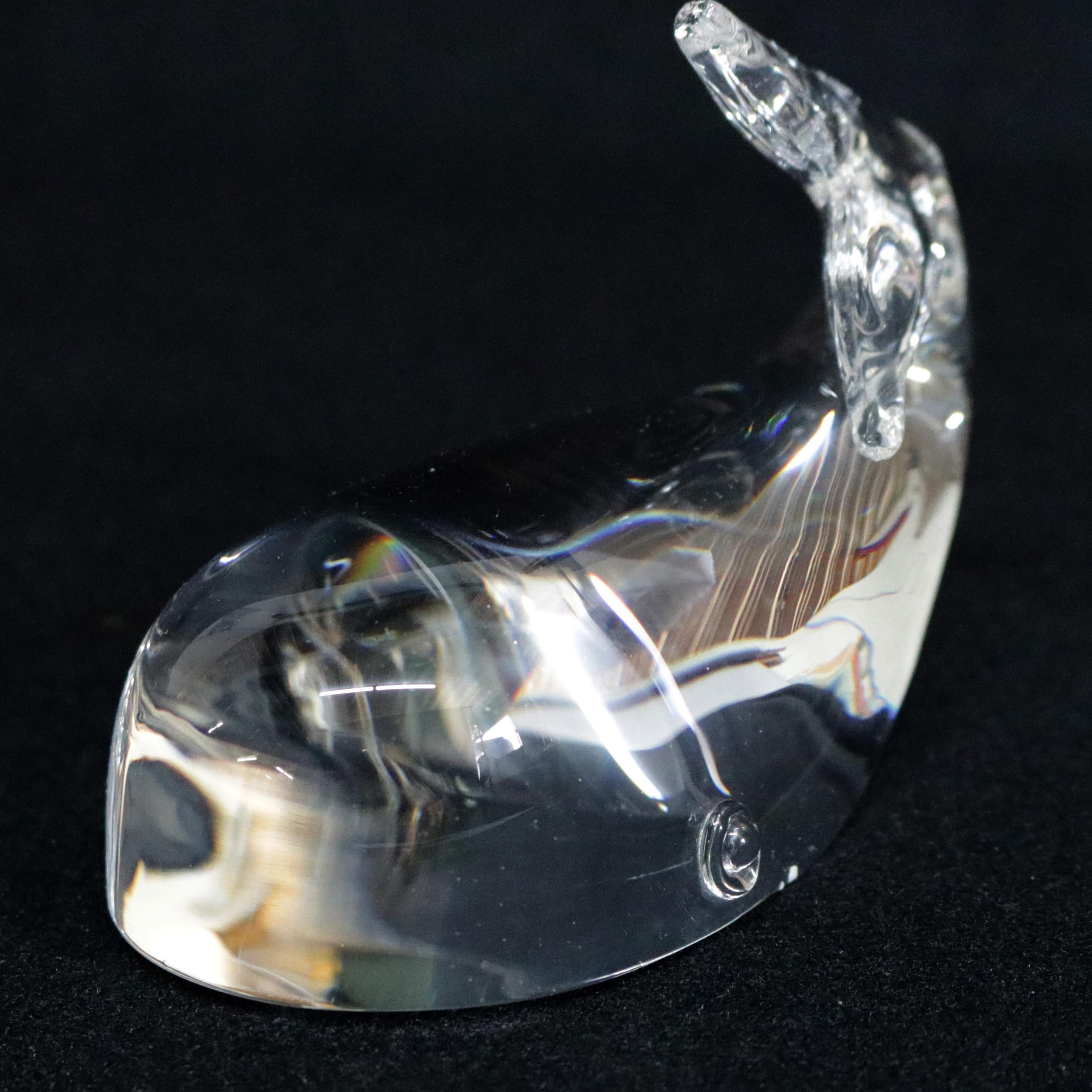 Midcentury Steuben figurative mouth blown crystal sculptural paperweight of features colorless art glass in full body form of Sophisticated Whale designed by Lloyd Atkins 1956 for Corning Museum of Glass, New York, NY, signed on base, 20th