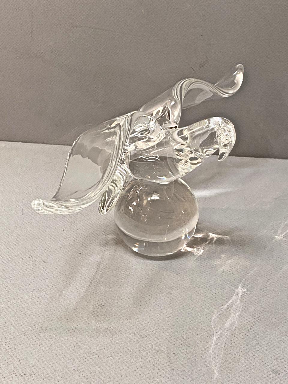This a beautiful example of a Steuben animal figure. The beauty and balance of the outswept wings of the eagle in flight are soul inspiring. The Steuben quality of glass is recognized across the globe. This eagle is in overall very good condition.