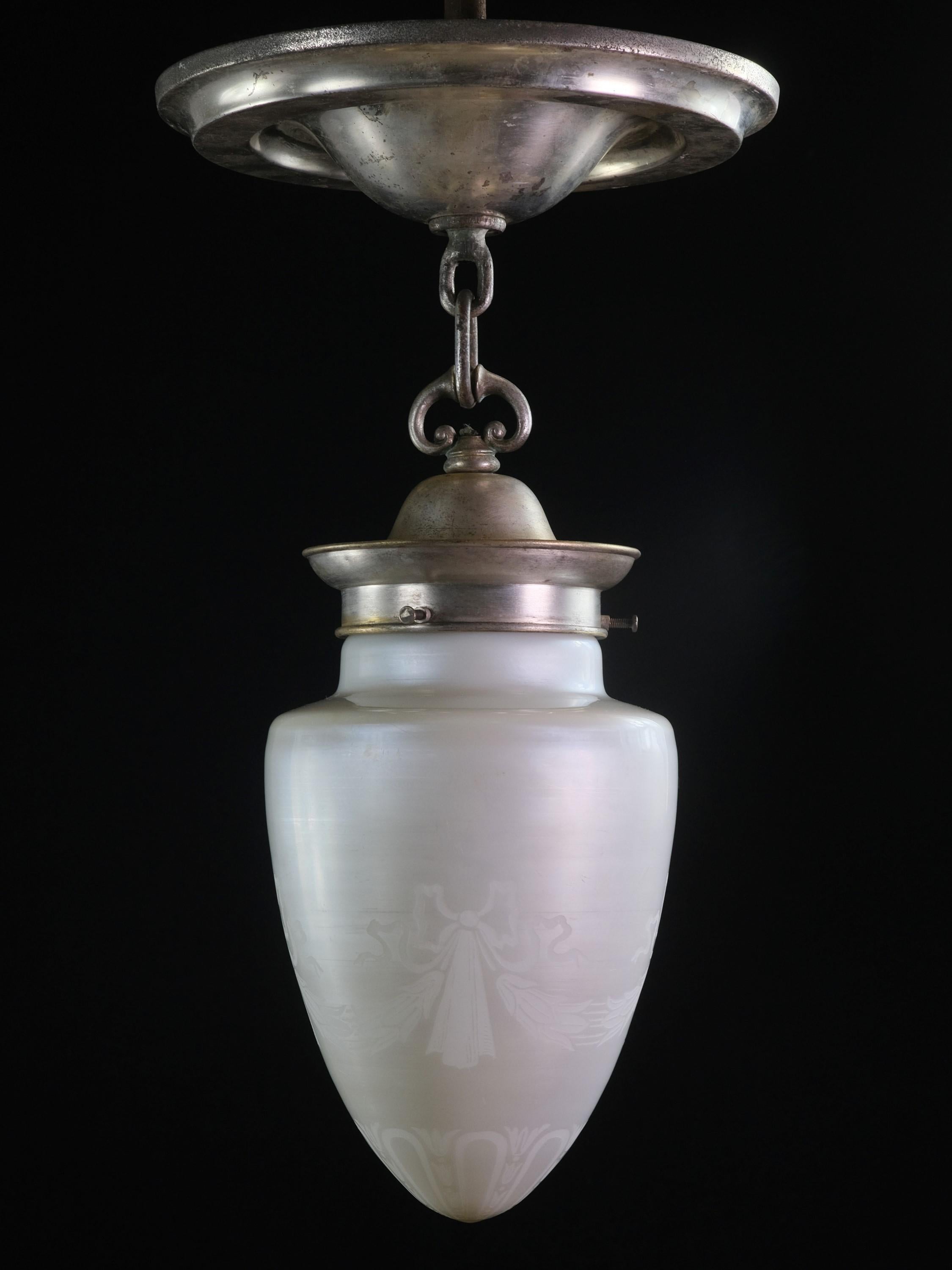 Antique Steuben iridescent cone shaped light with silver plated brass fitter.  The glass globe has etched ribbon and foliate details.   Price includes restoration. This can be seen at our 400 Gilligan St location in Scranton, PA.