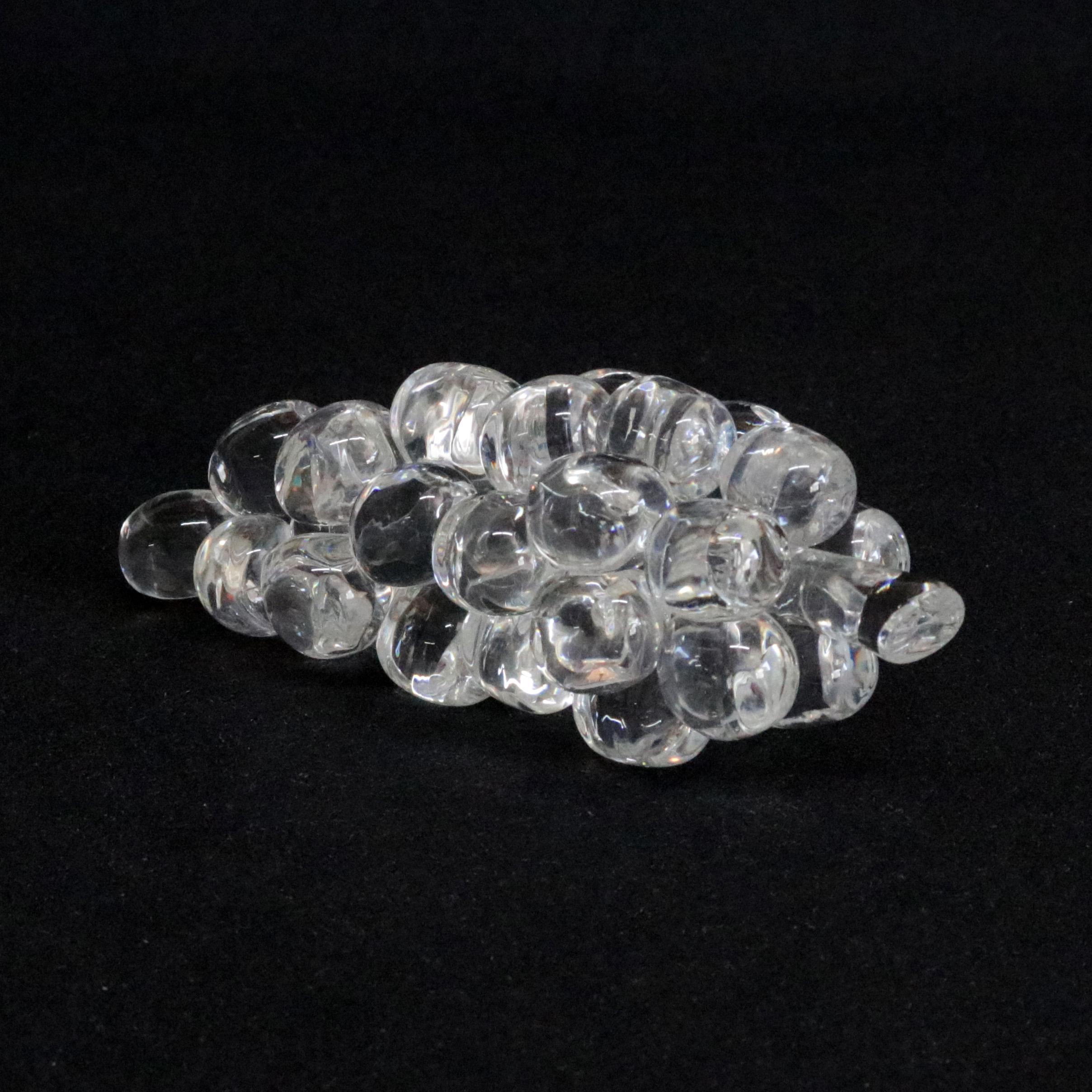 Midcentury Steuben figurative mouth blown crystal fruit sculptural paperweight features colorless art glass in full body form of Grape Cluster designed in the 1940s by Corning Museum of Glass, New York, NY, signed on base, 20th century

Measures -