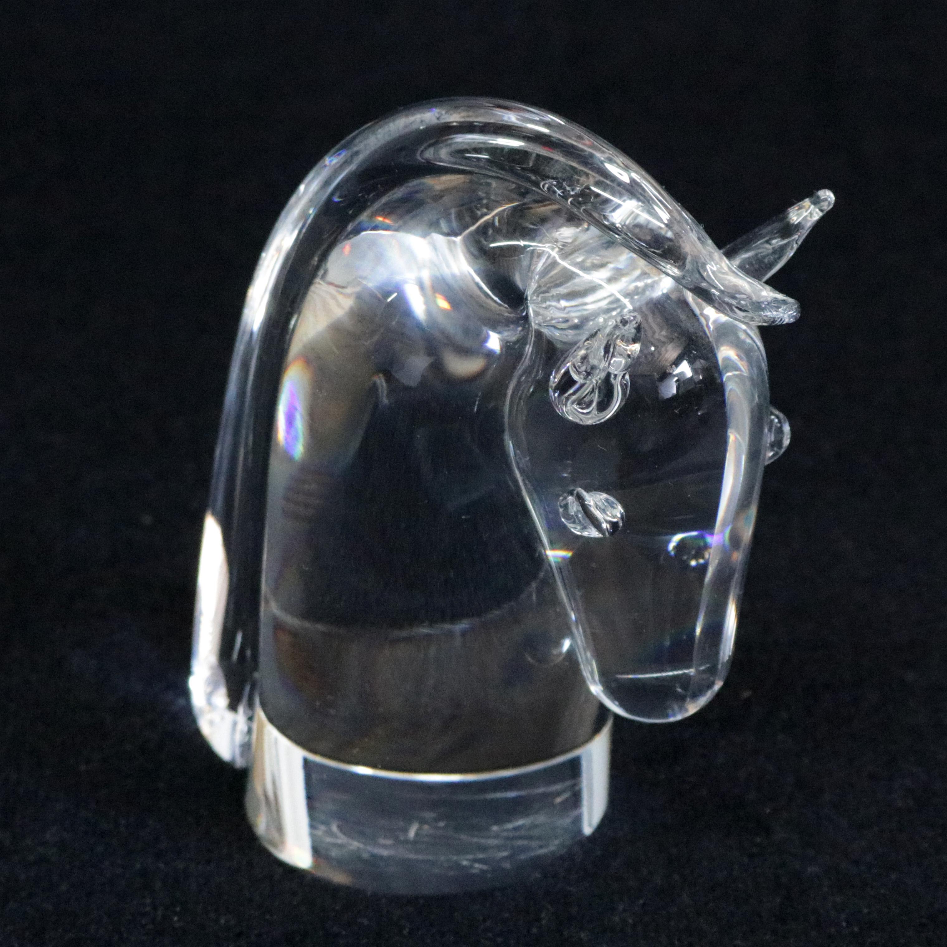 Midcentury Steuben figurative mouth blown crystal sculptural equine paperweight features colorless art glass in form of Horse Head designed by David Dowler for Corning Museum of Glass, New York, NY, signed on base, 20th century.
 

Measures: 4.5