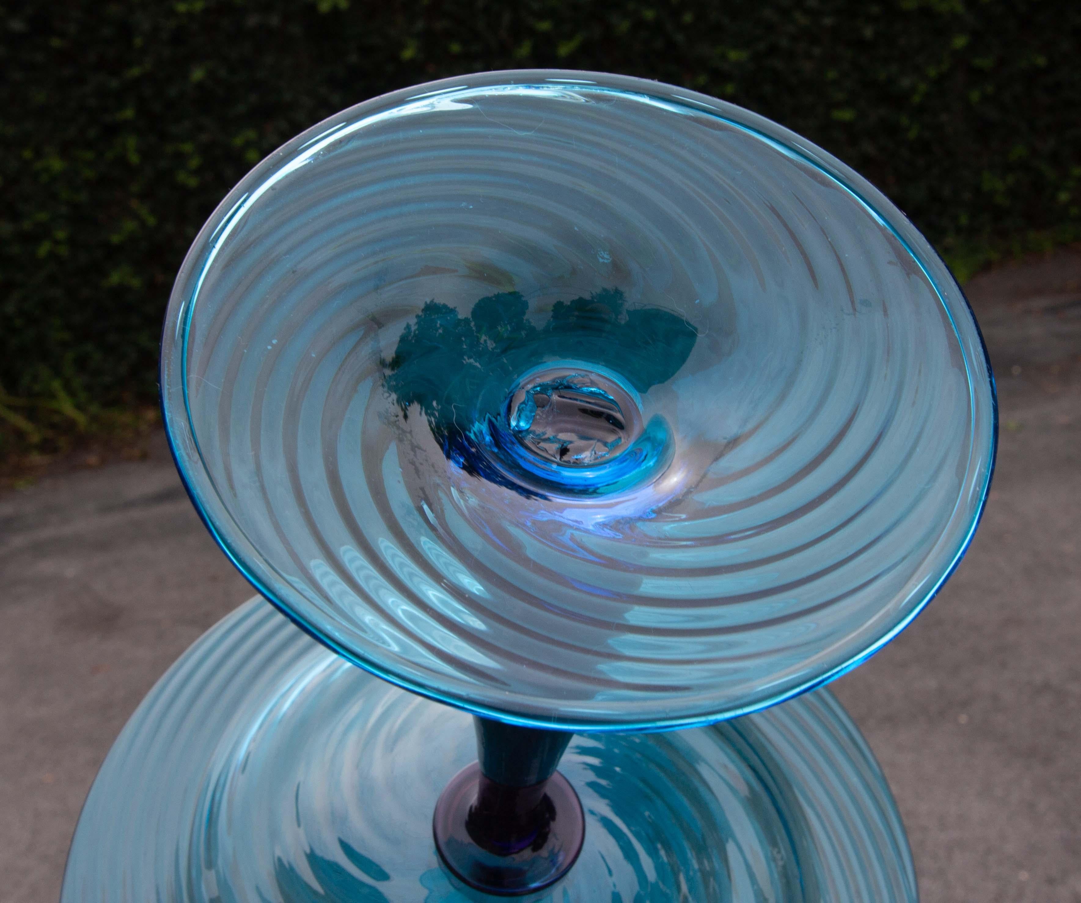 Hand crafted glass compote by Steuben. Celeste blue and amethyst glass with flecks. Circa 1920's. Includes vintage 1933 guide to Steuben. 
