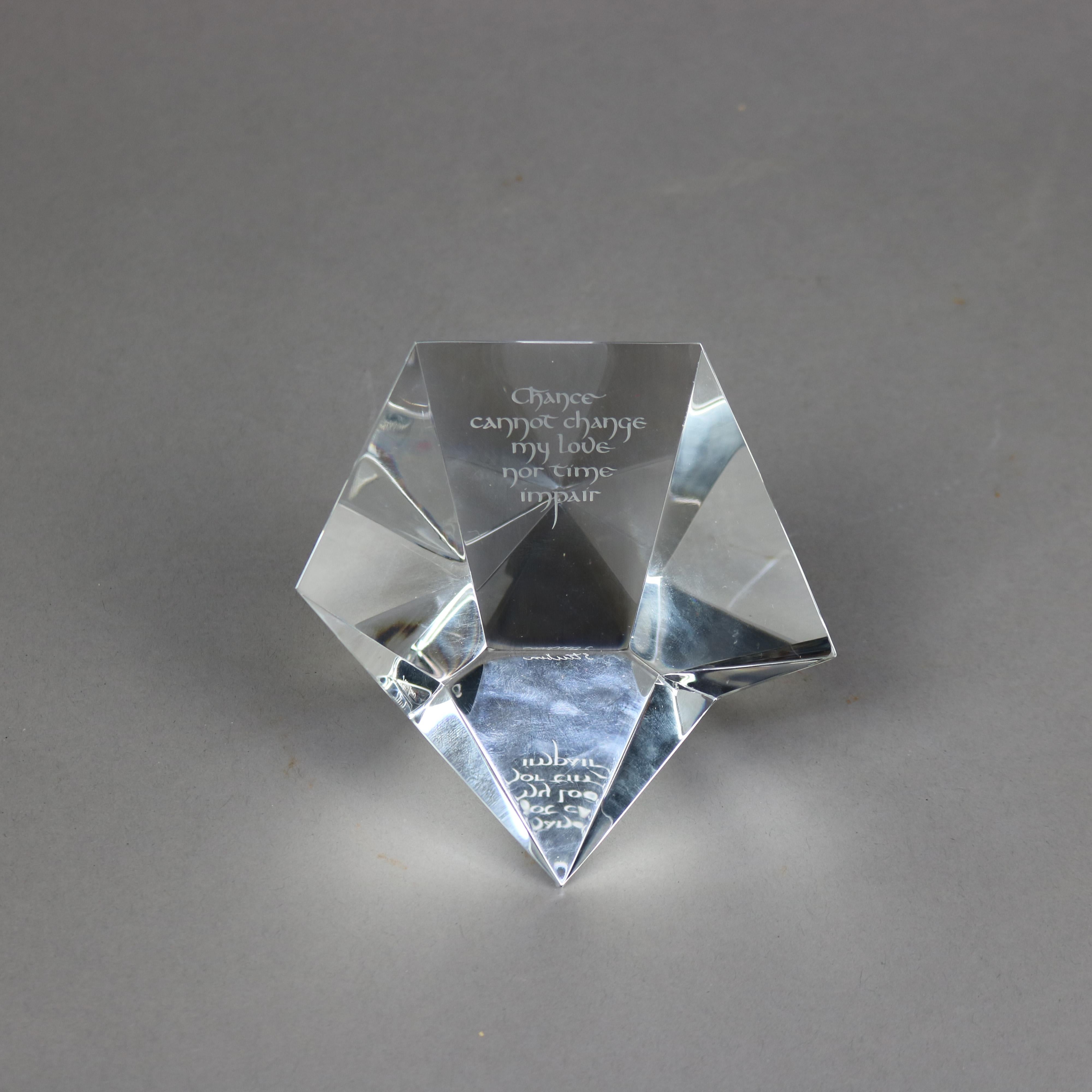 A desk sculpture paperweight by Steuben offers colorless art glass construction in diamond prism form with etched 