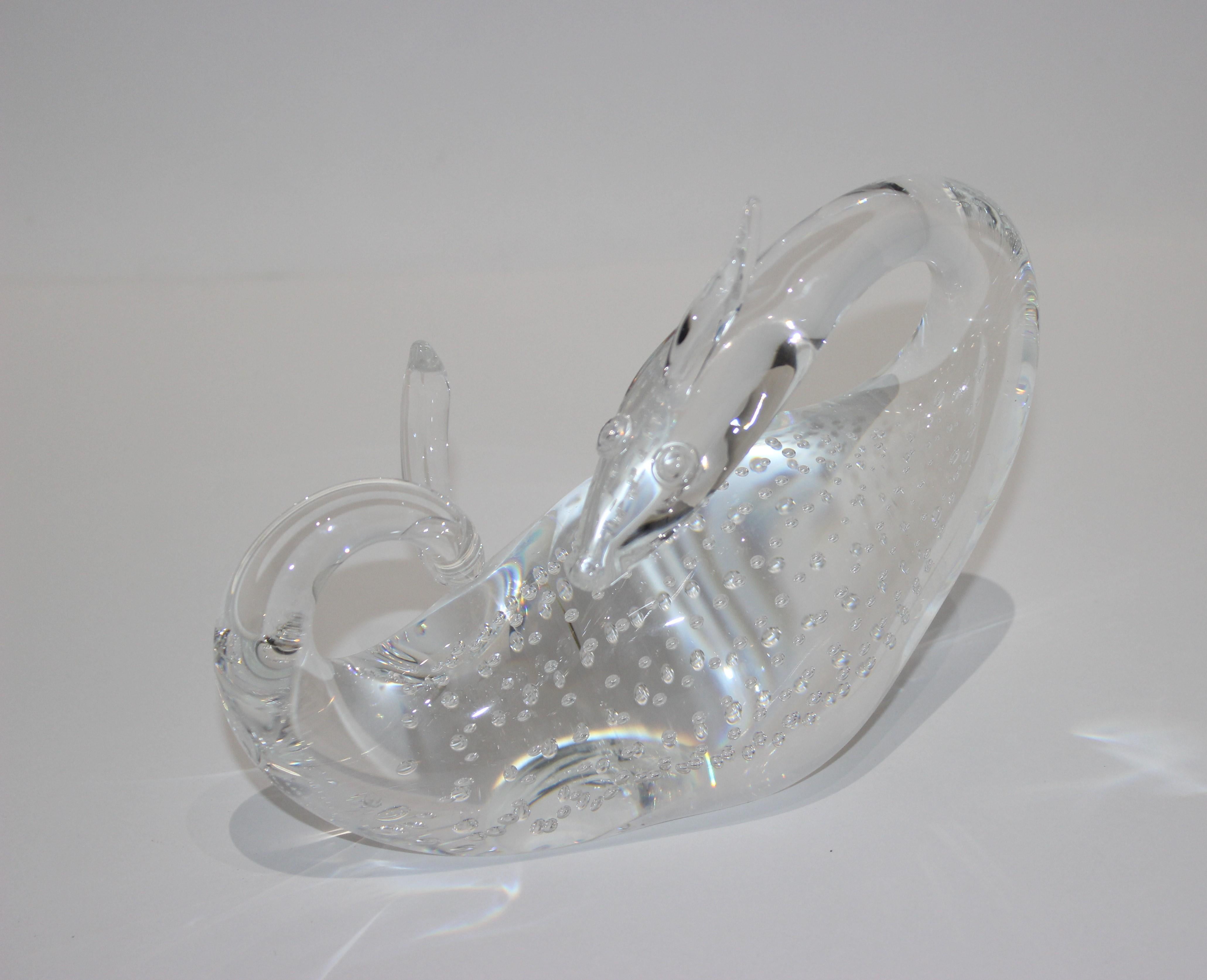 Clear glass dragon controlled bubble by Steuben.
Signed on verso.