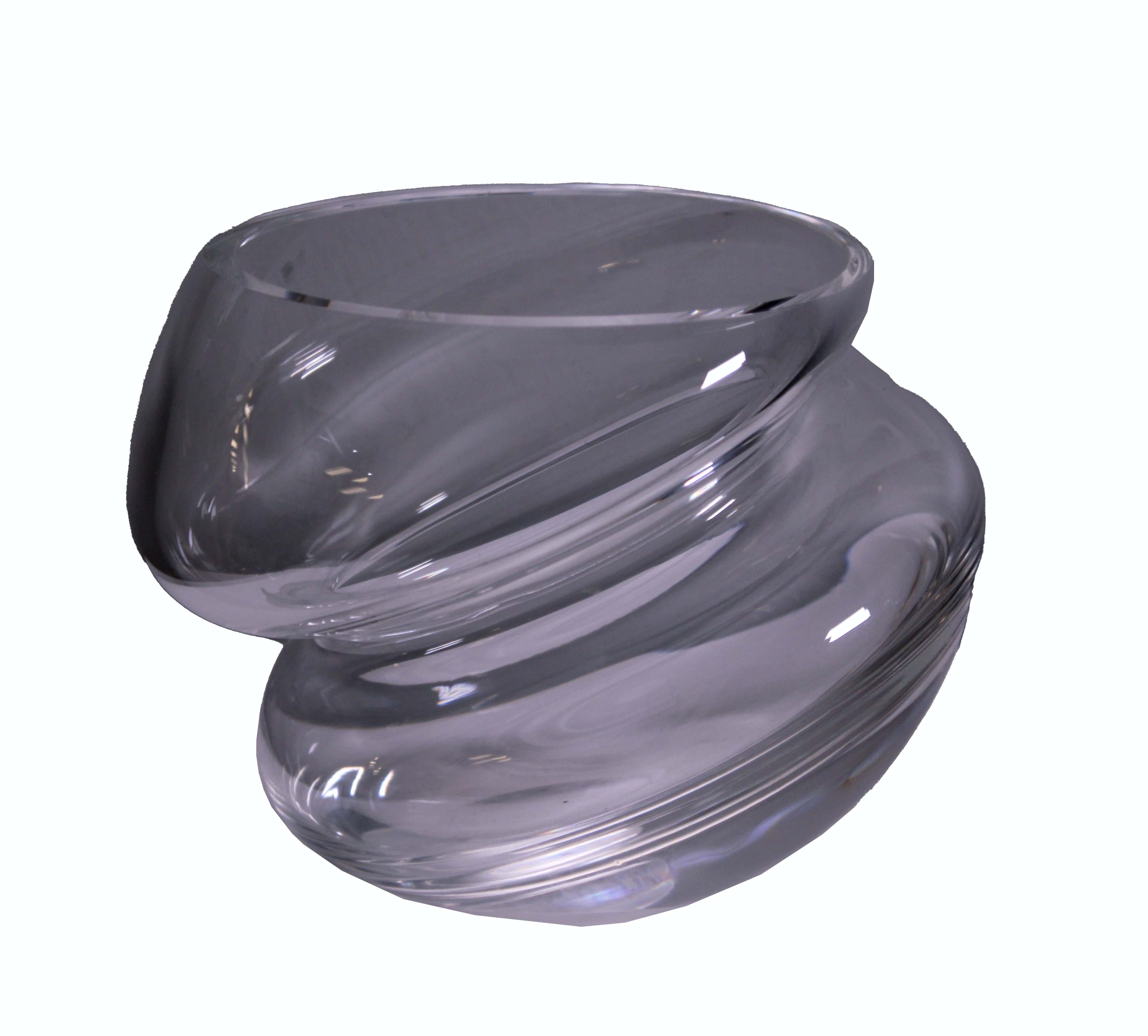 This sleek Steuben crystal nimbus dish is the perfect addition to any home. Featuring an elegant, modern design, this stunning piece will bring a touch of sophistication to your decor. This curved bowl gives the effect of a double stacked bowl. It's