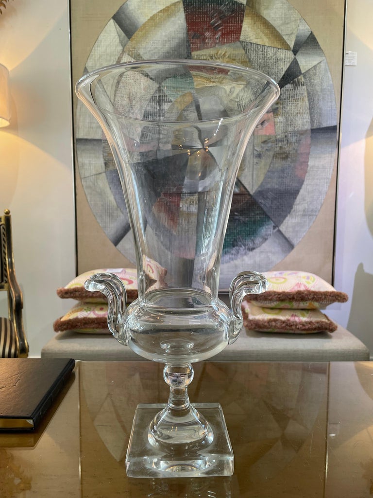 This stylish large scale trumpet vase dates to the 1930s-1940s and was created by the Steuben Glass Company.

Note: The piece is not signed and was a production sample.

Note:  There are surface abrasions on the verso of the base and also in the