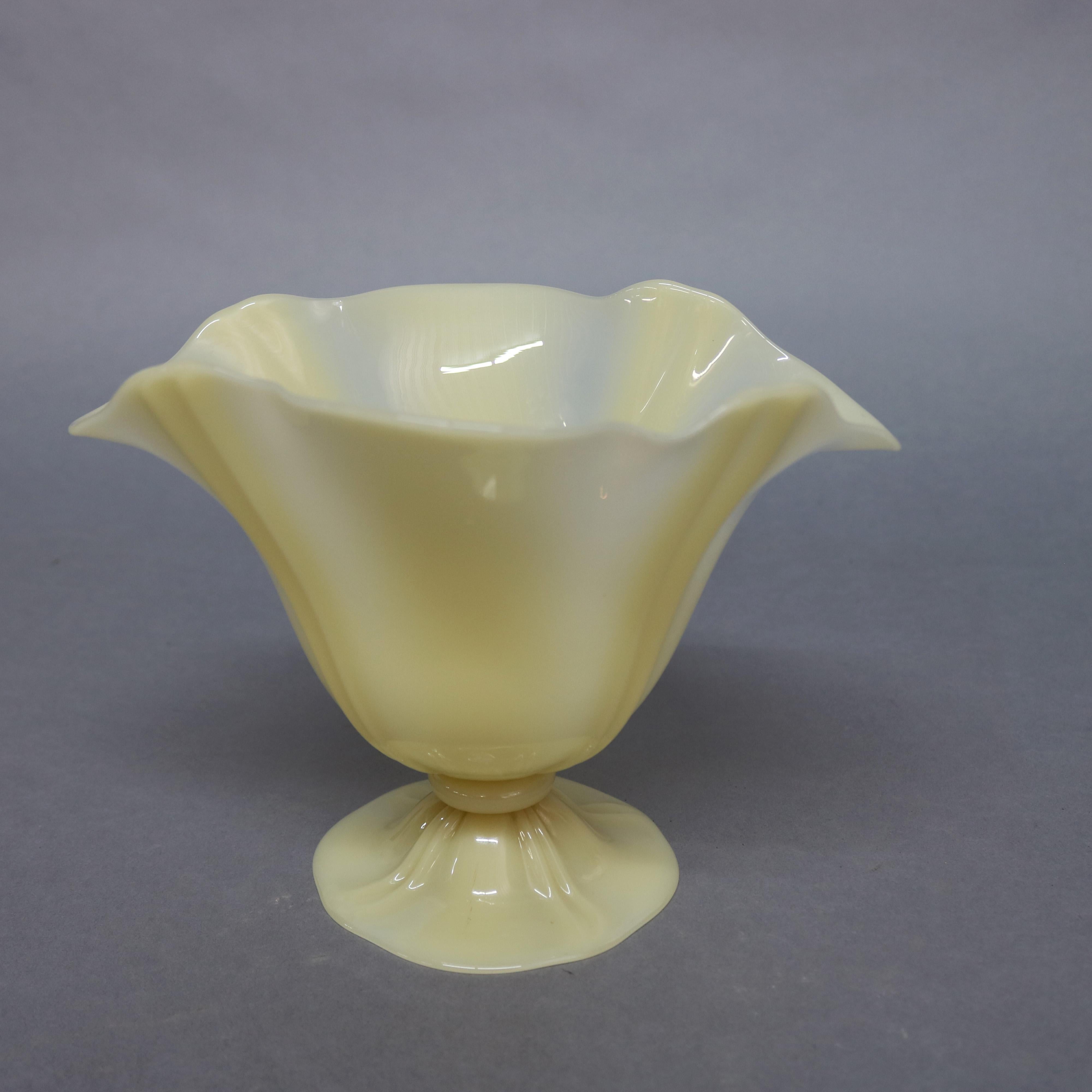 Steuben vase features ivorene art glass with ruffled bowl surmounting footed base, c1930

***DELIVERY NOTICE – Due to COVID-19 we are employing NO-CONTACT PRACTICES in the transfer of purchased items.  Additionally, for those who prefer to delay