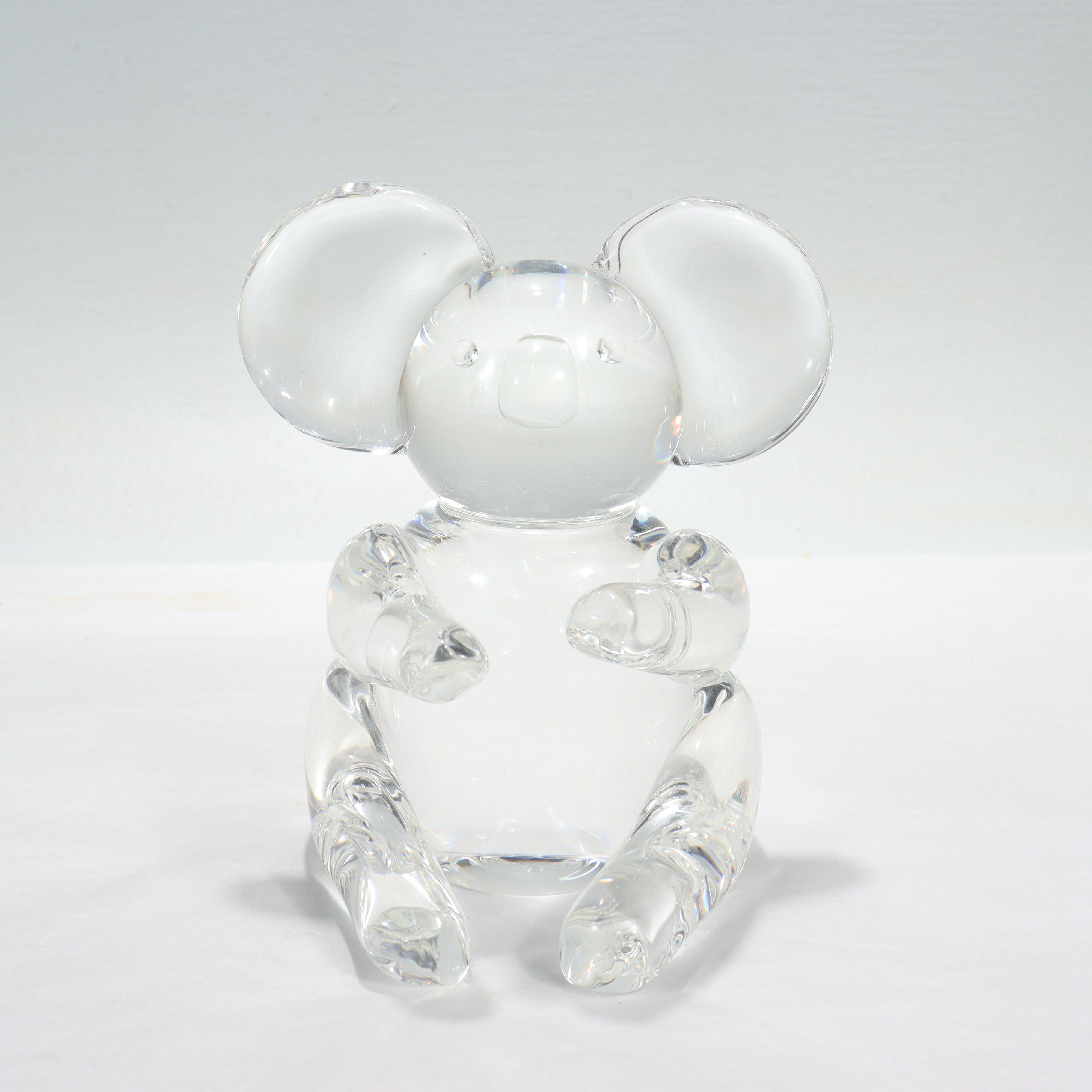 A fine art glass koala bear figurine or sculpture.

By Steuben.

Model no. 8268.

Designed by Lloyd Atkins.

Simply a wonderful koala figurine from Steuben!

Date:
Mid-20th Century

Overall Condition:
It is in overall good, as-pictured, used estate