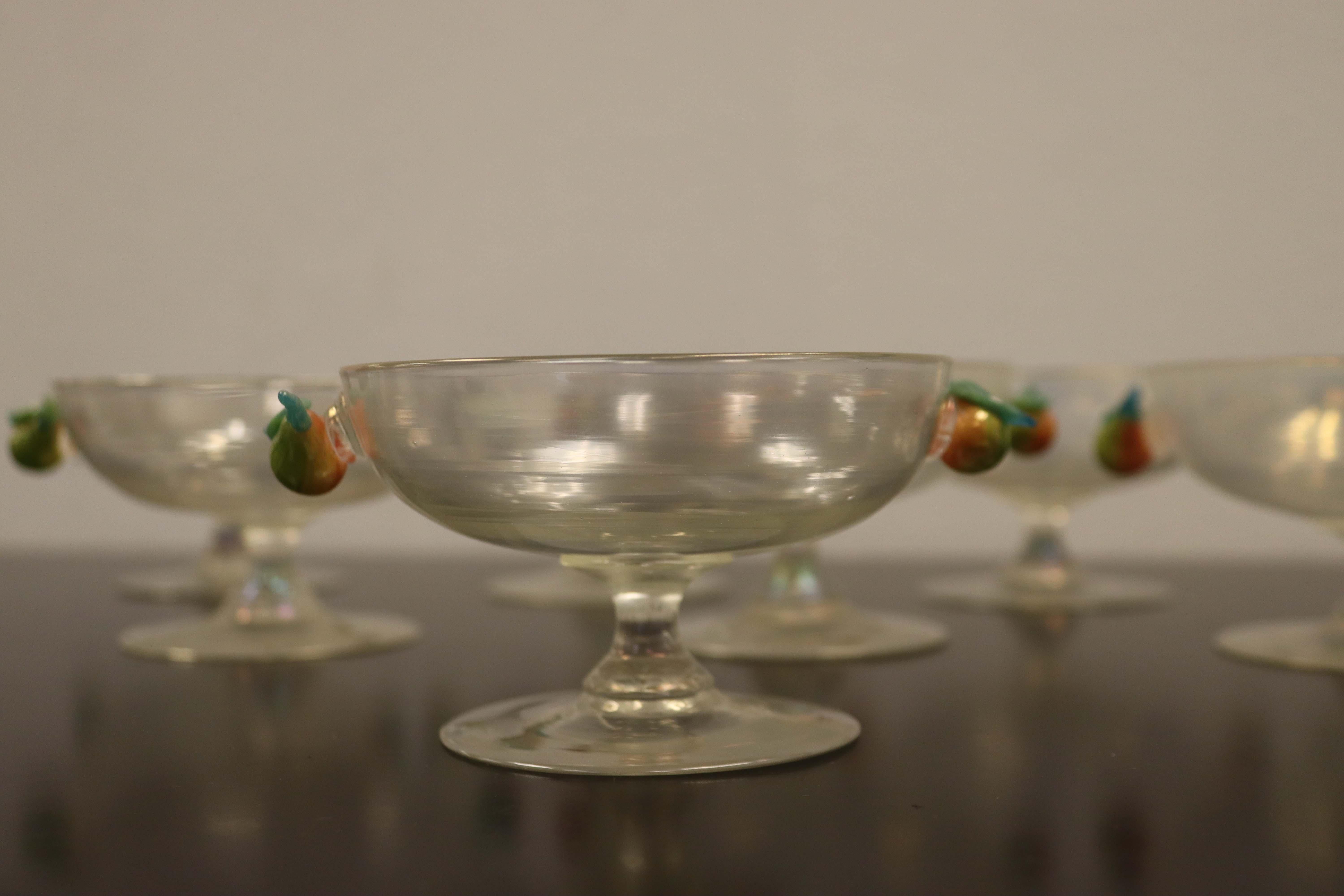 Lovely set of 8 compote serving glasses by Steuben with 2 hand blown, decorative pears adorning each.

In very good condition, with nearly imperceptible flea bite chips on the pear leaf. The rims are in perfect condition.