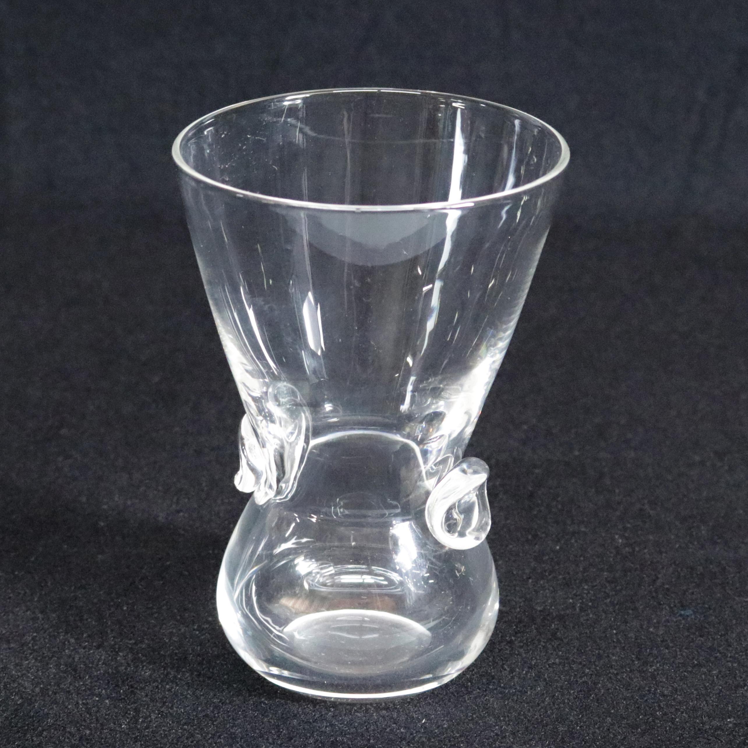 Mid-Century Modernist Steuben mouth blown Signet Vase features colorless art glass in flared form with pinched dot base designed by David Hills for Corning Museum of Glass, New York, NY, signed on base, 20th century.

Measures: 6