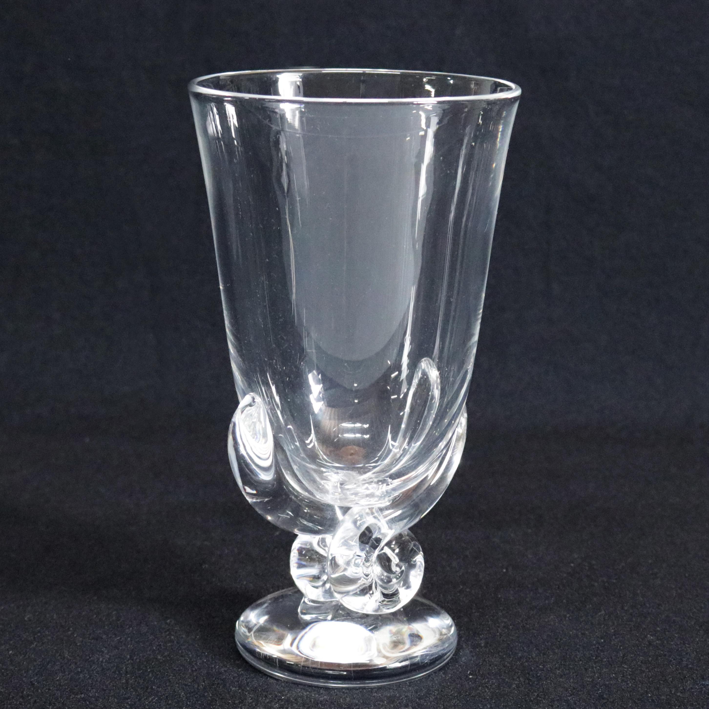 Midcentury modernist Steuben mouth blown Scroll Vase features colorless art glass in slightly flared form with seated on scrolled and footed base designed by George Thompson for Corning museum of glass, New York, NY, signed on base, 20th