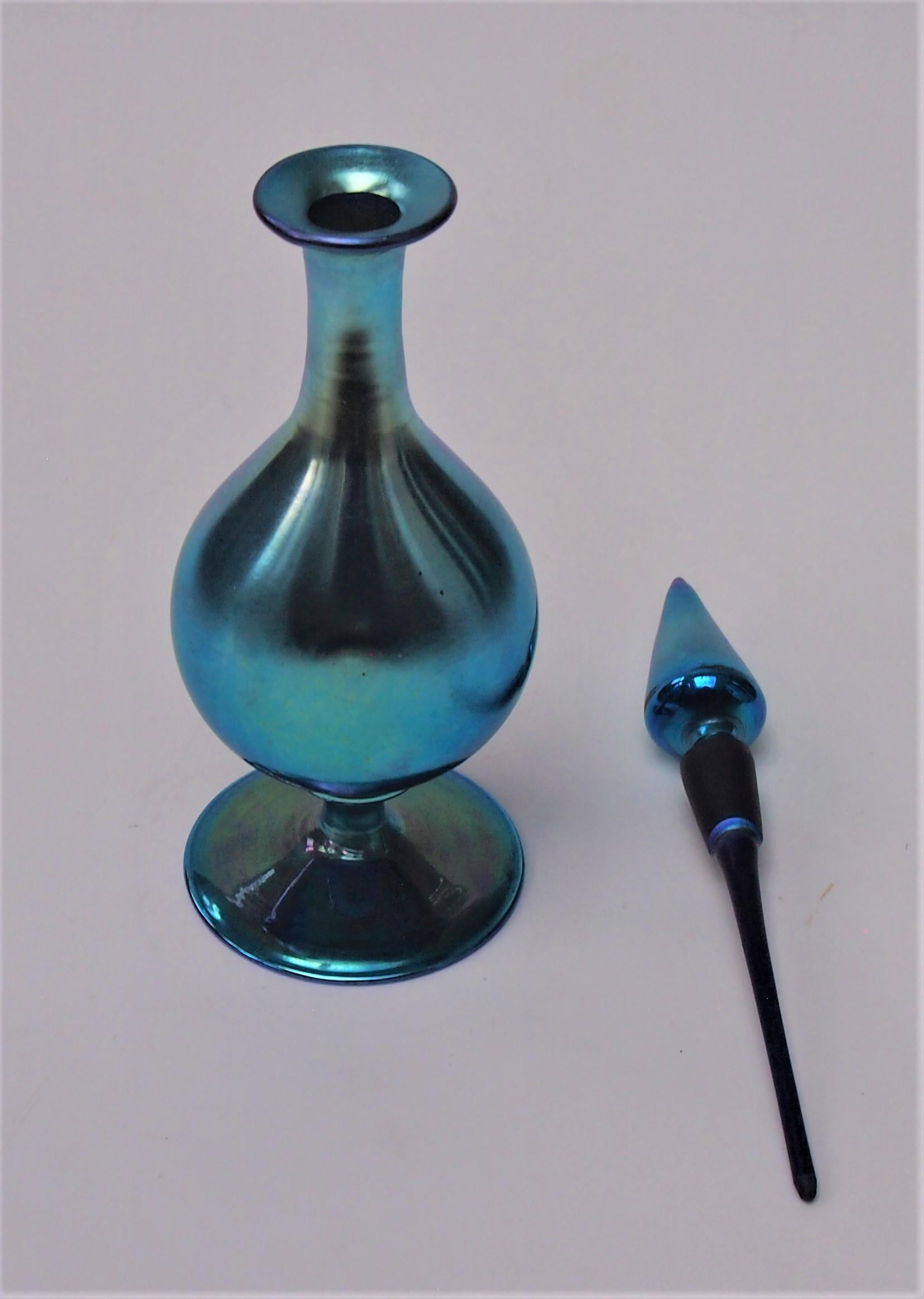 Amazing fully signed blue aurene Steuben long stopper scent bottle by Frederick Carder c1915 signed Steuben Aurene with the shape code 3174. The blue aurene gives the bottle a fabulous high finish blue mirror like iridescence.  The scent bottle has